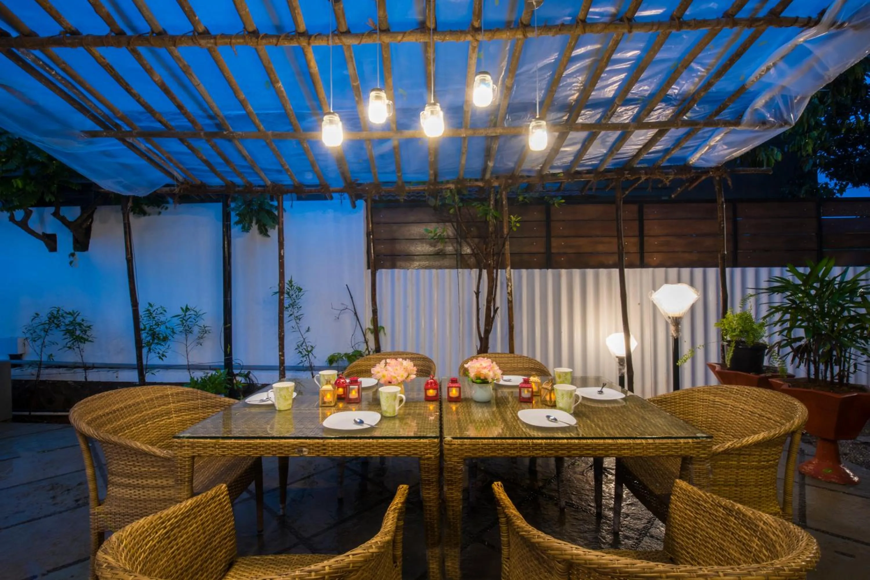Dining area in EL Lodge by StayVista - Pool, lawn, and a charming gazebo for your perfect getaway