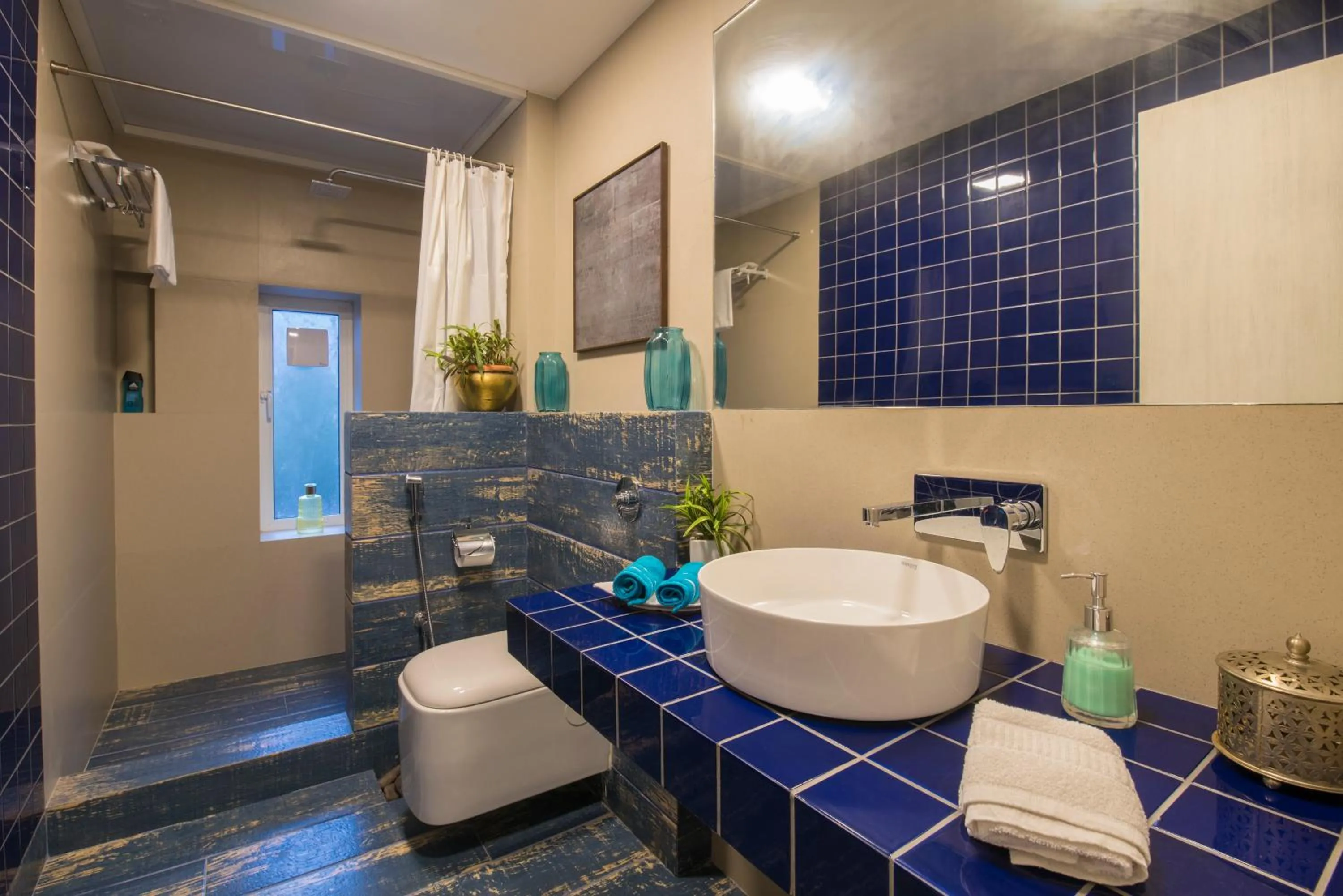 Bathroom in EL Lodge by StayVista - Pool, lawn, and a charming gazebo for your perfect getaway