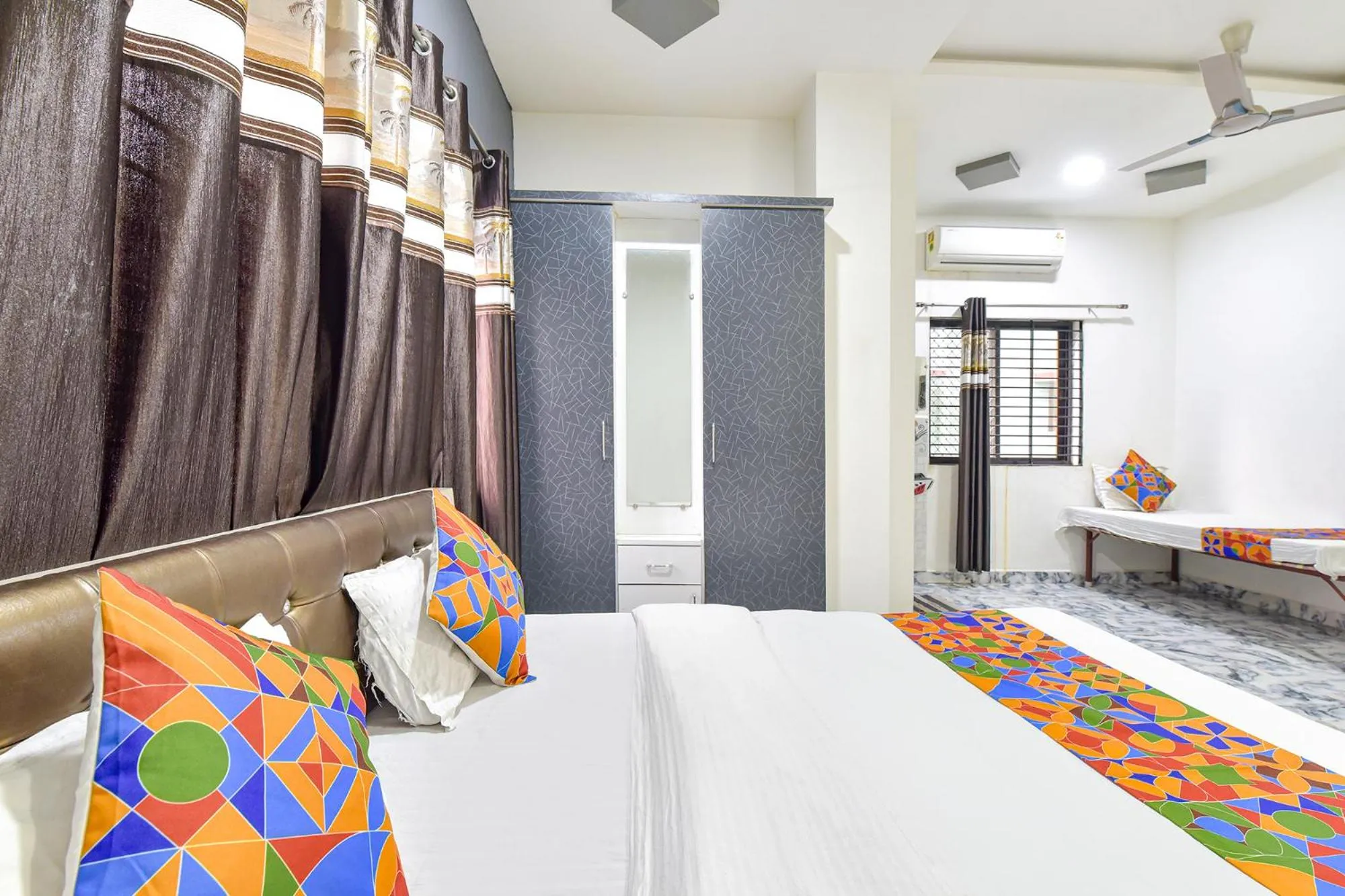 Bed in FabHotel Soni Palace