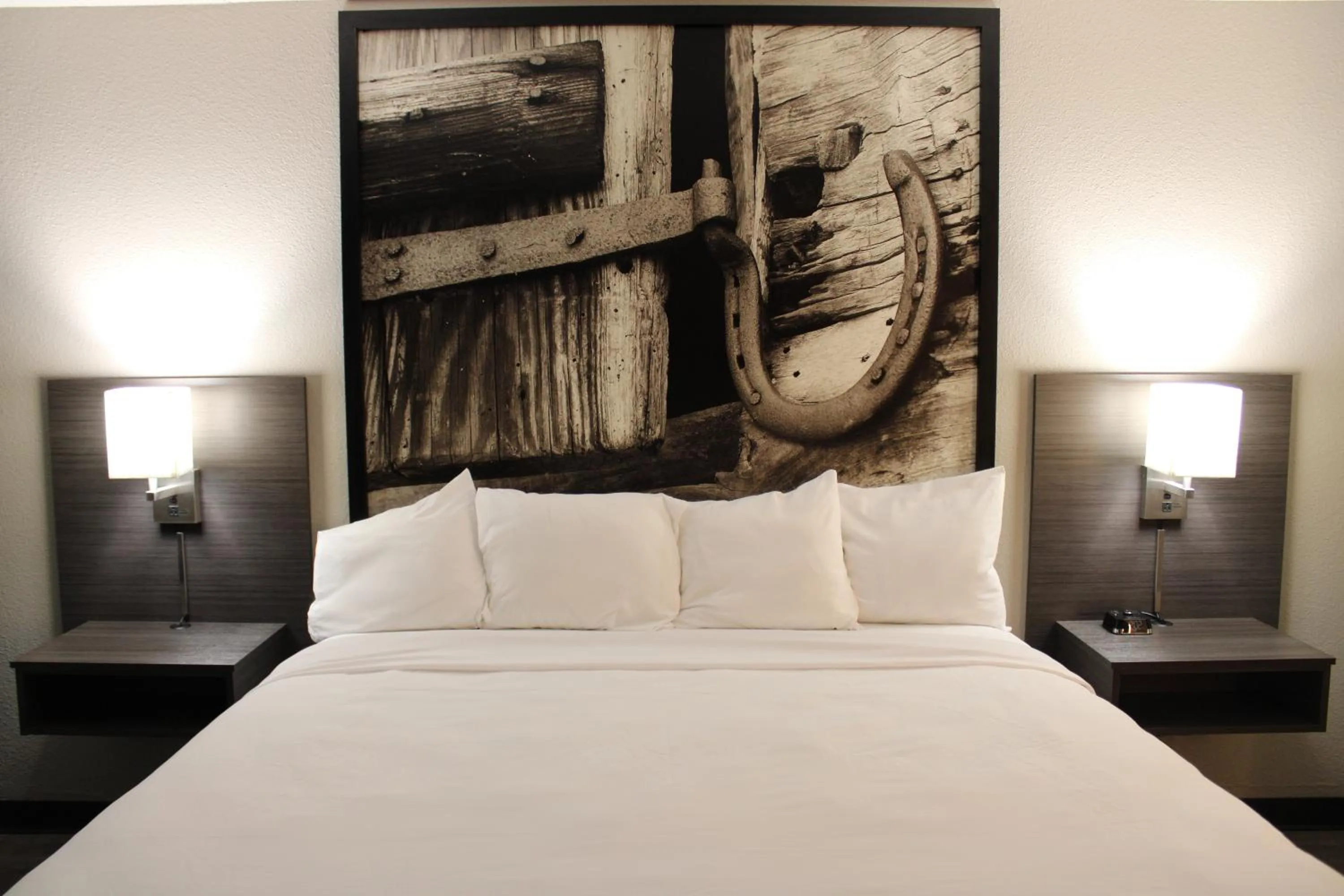 Bed in Boarders Inn and Suites by Cobblestone Lamar Missouri