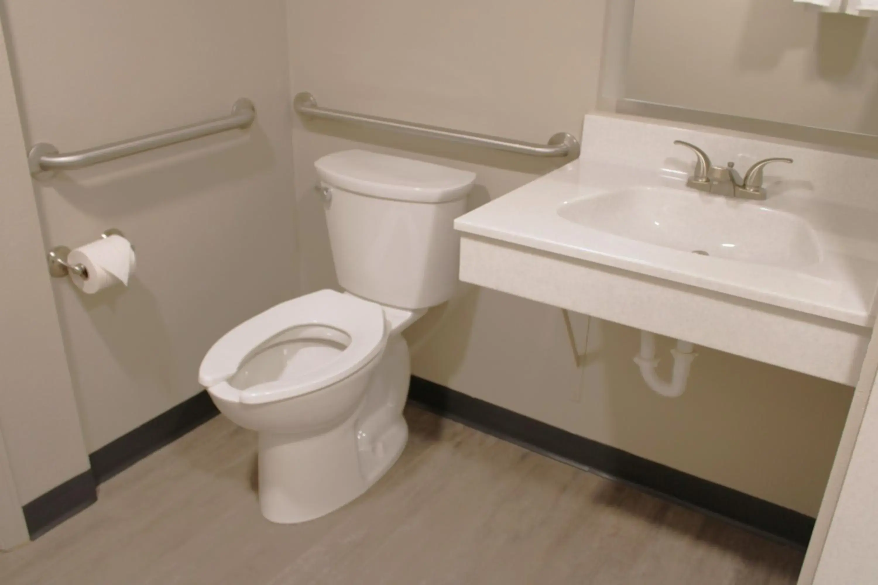 Toilet in Boarders Inn and Suites by Cobblestone Lamar Missouri Toilet in Boarders Inn and Suites by Cobblestone Lamar Missouri