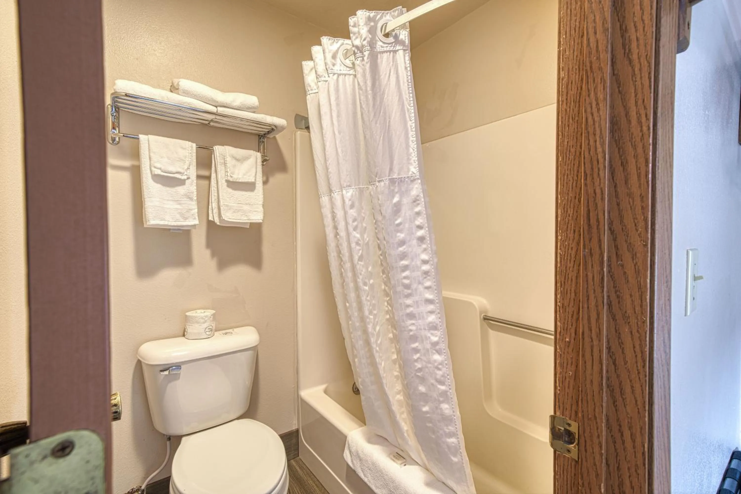 Toilet in Super 8 by Wyndham Sturgis