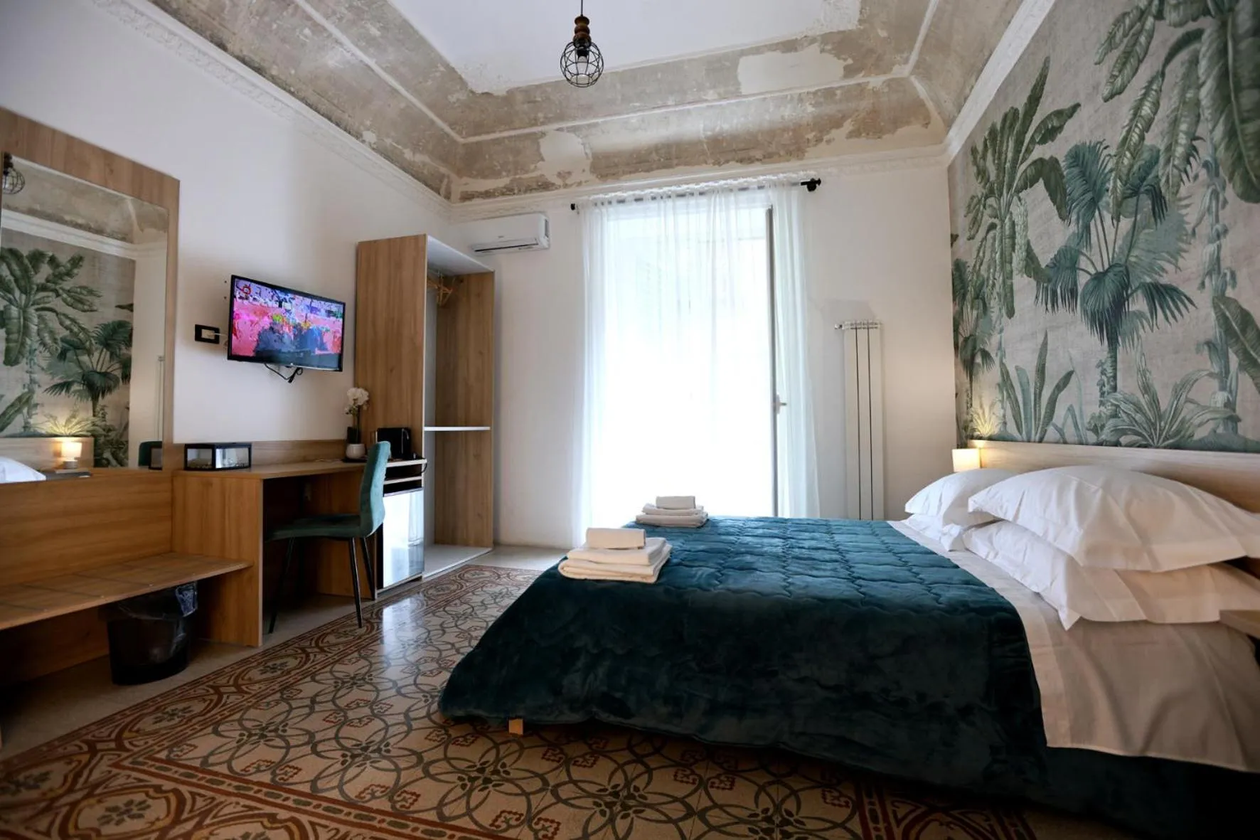 Bed in Pupi 93 Rooms