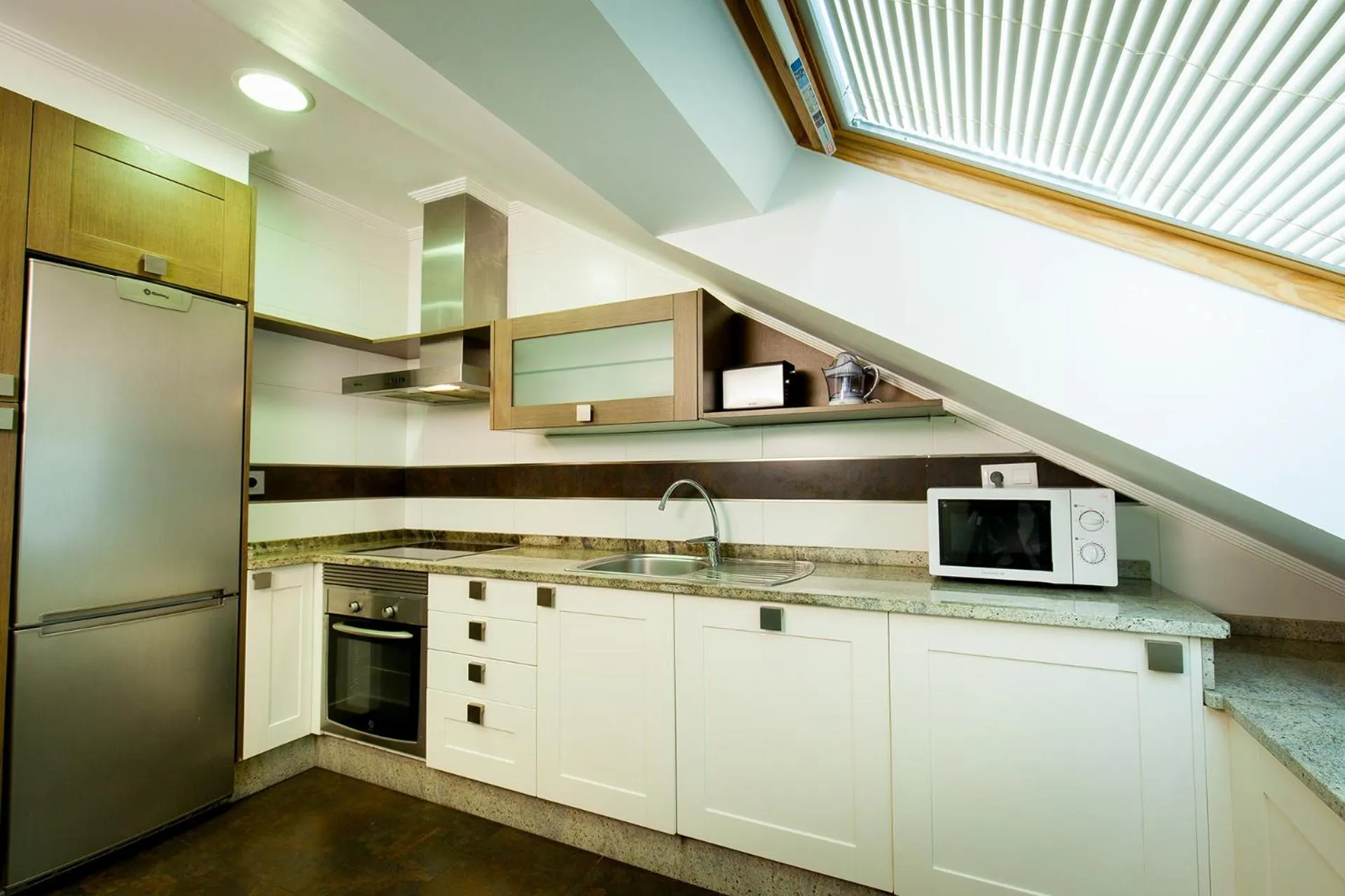 Kitchen or kitchenette in Apartamentos Villa Zoila Baiona