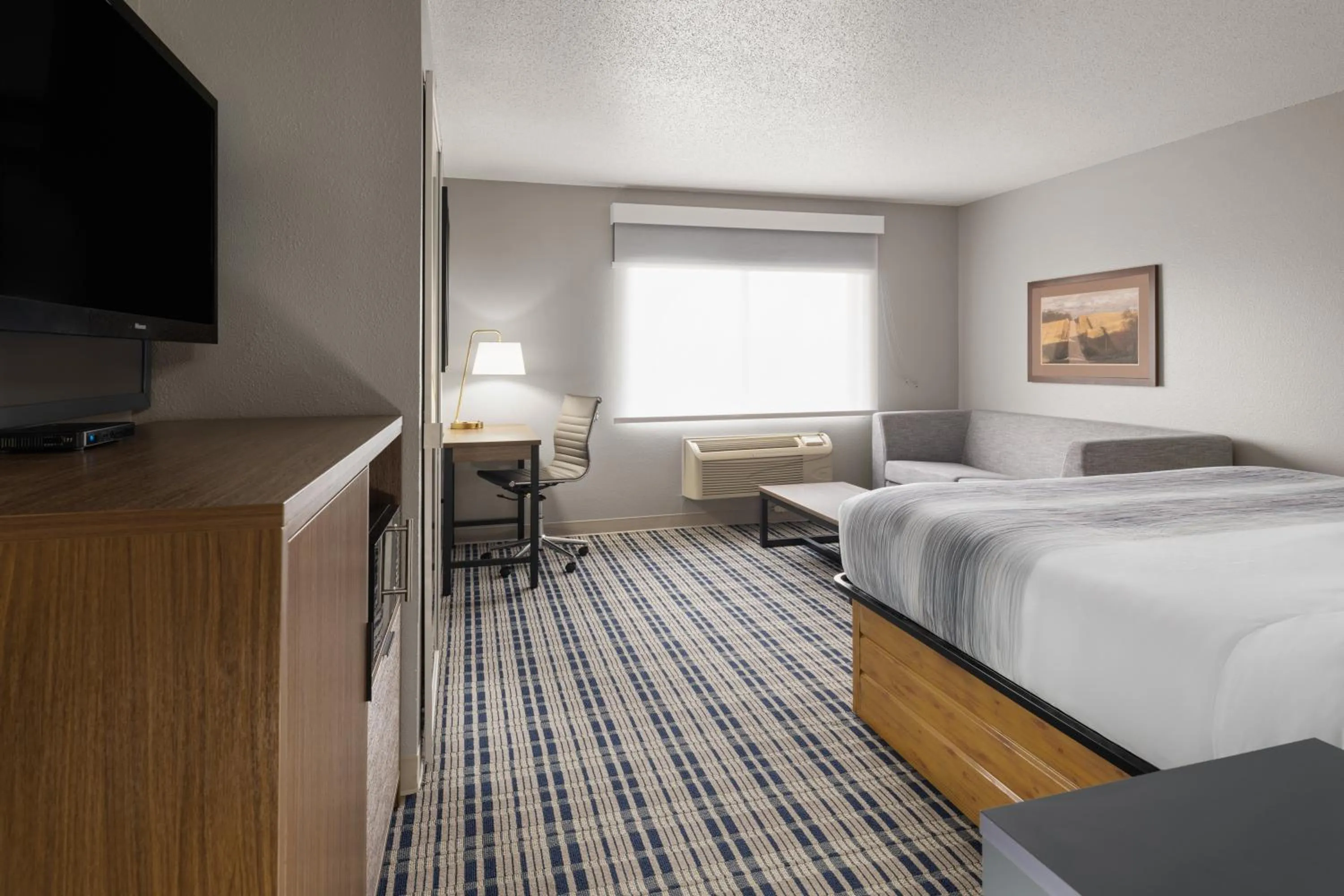 Bed in AmericInn by Wyndham Muscatine