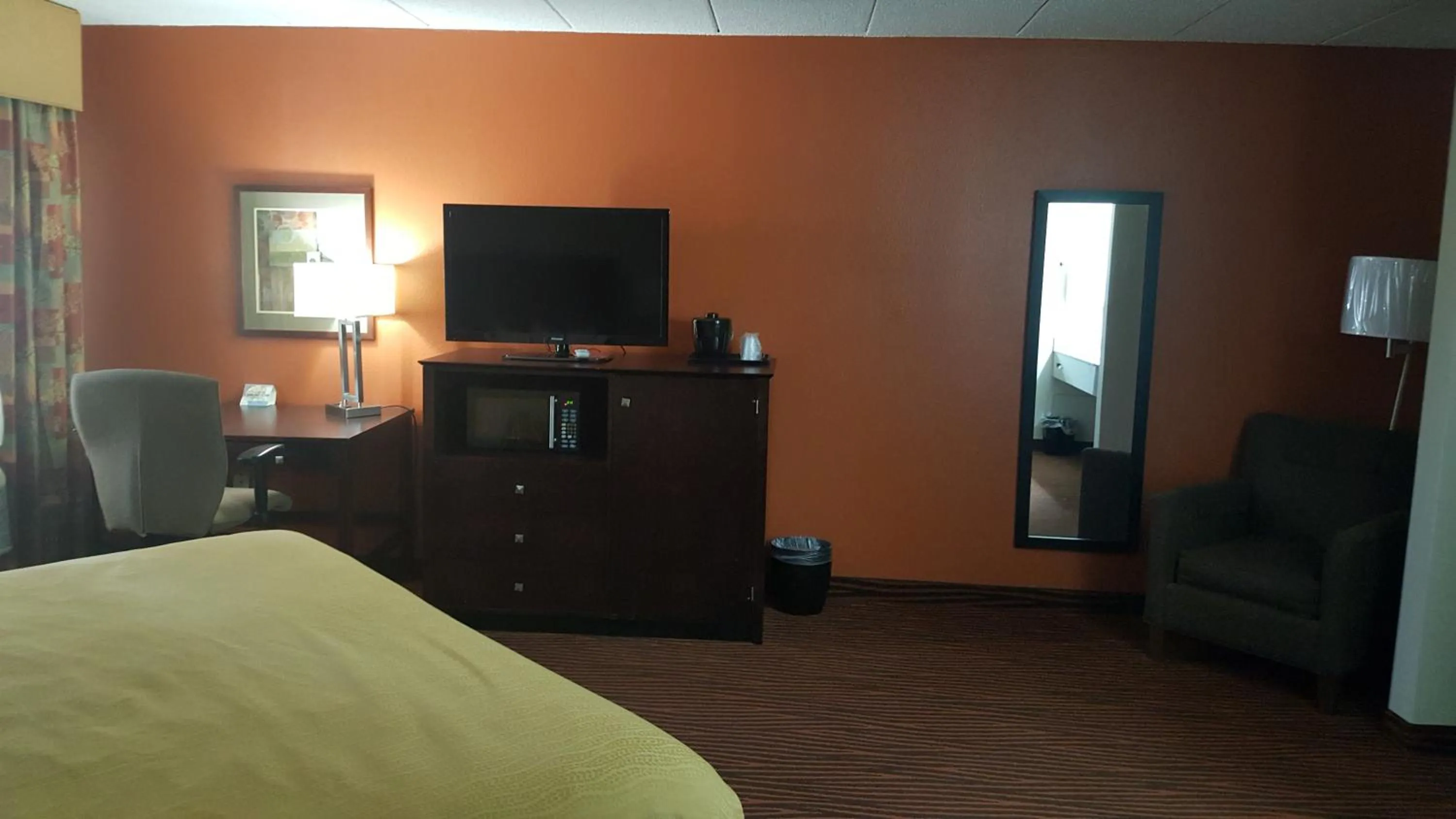 Bed in AmericInn by Wyndham Muscatine