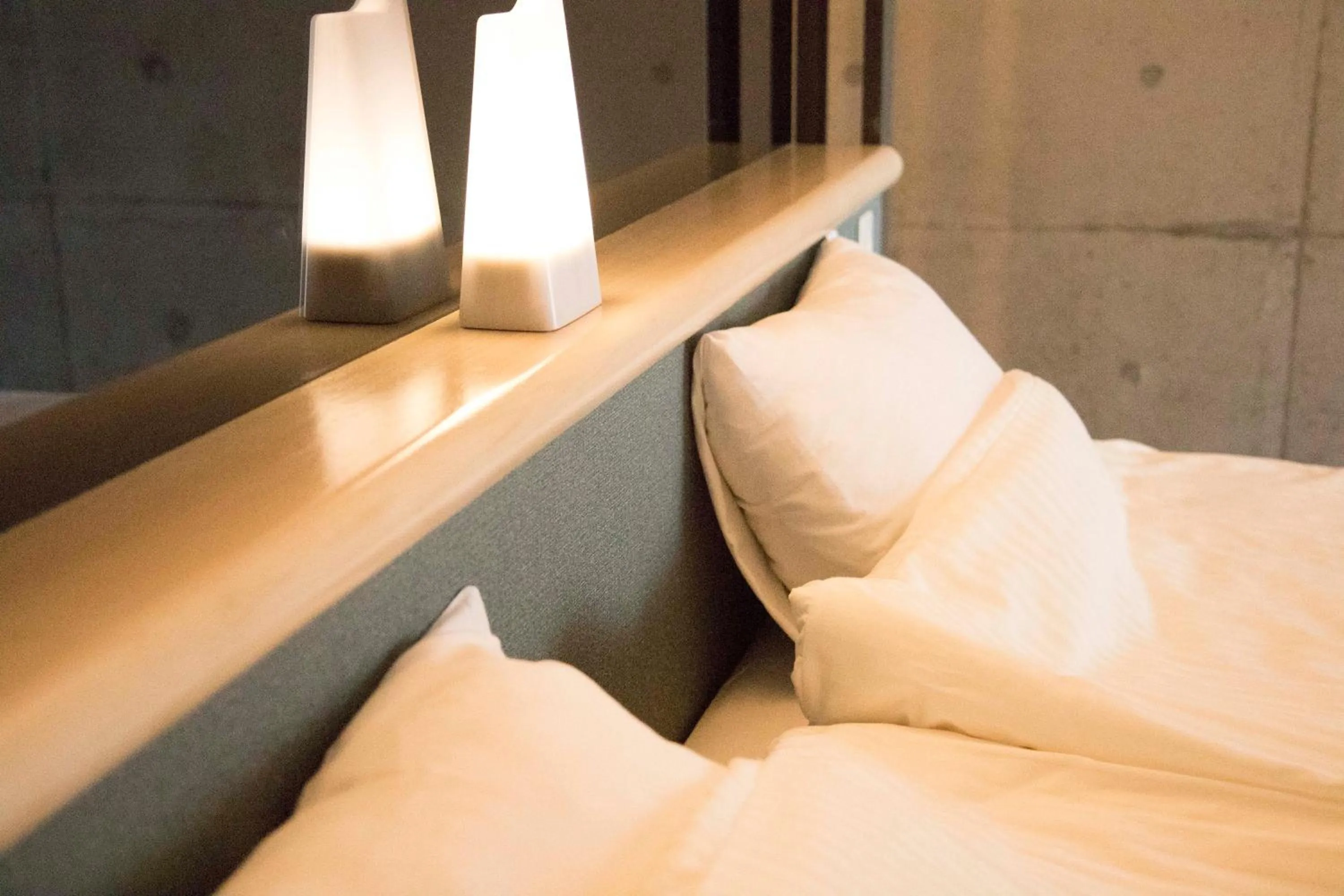 Bed in Blue Suites Hanamuro on the beach