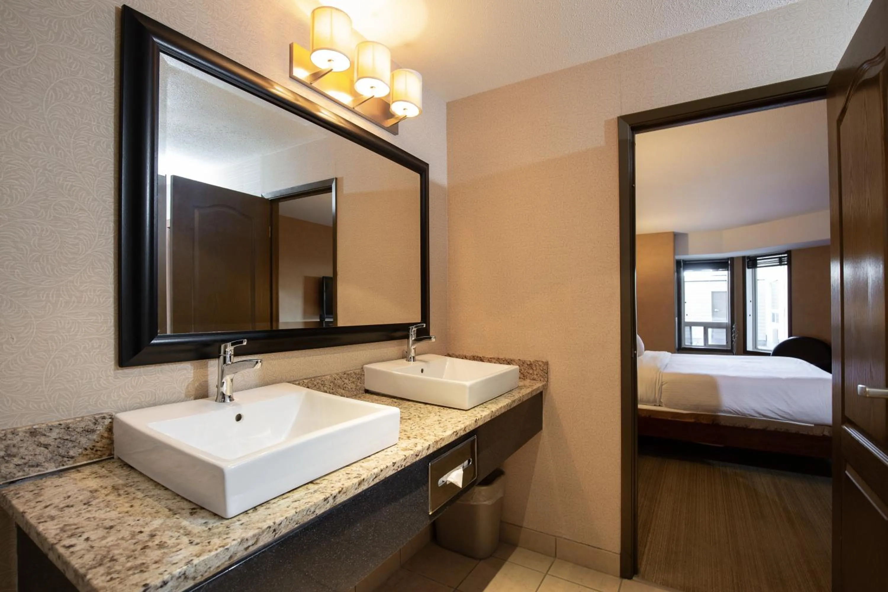 Bathroom, Bed in Pomeroy Hotel Fort St. John