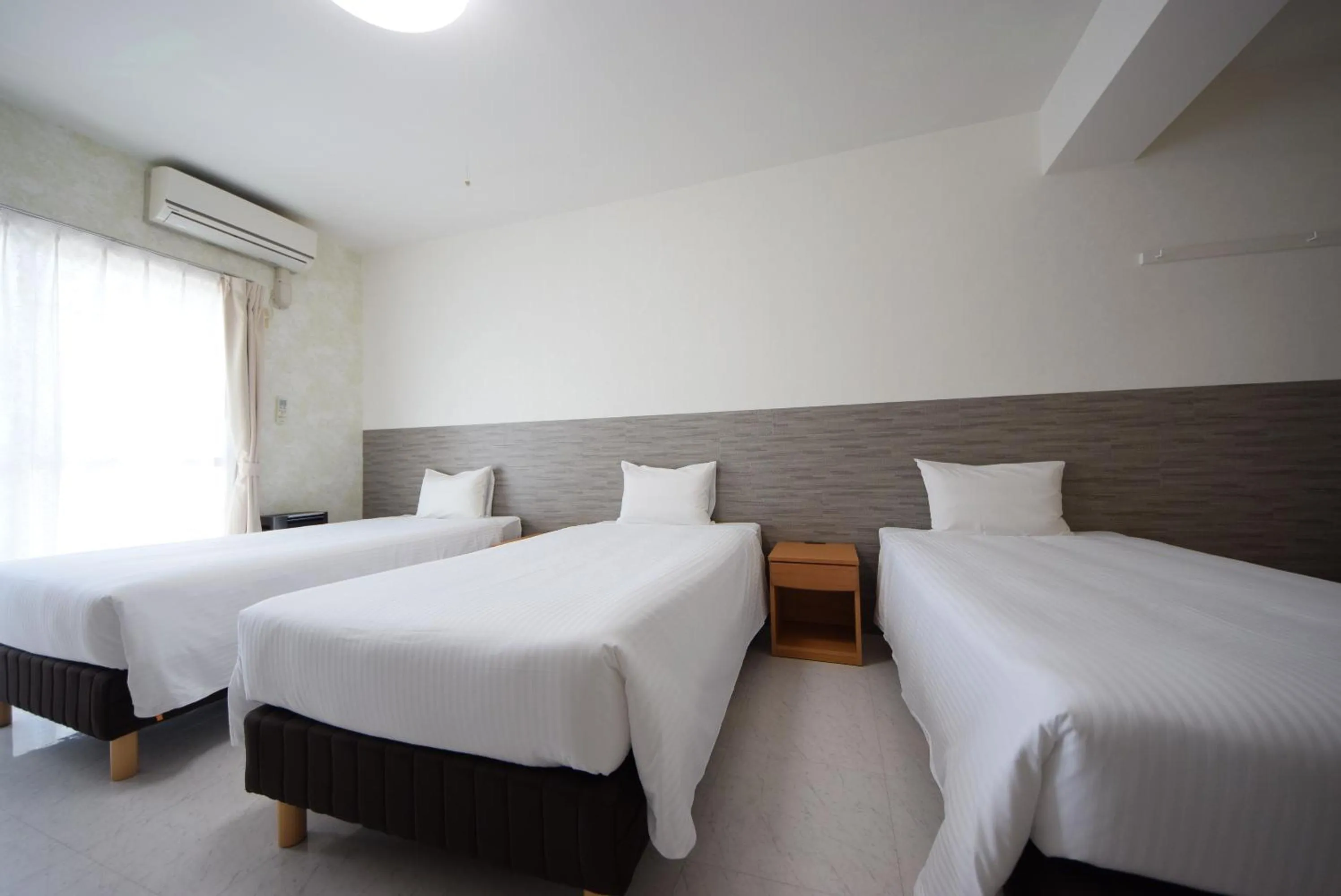 Bed in STAY IN SUMUKA Kokusai Street