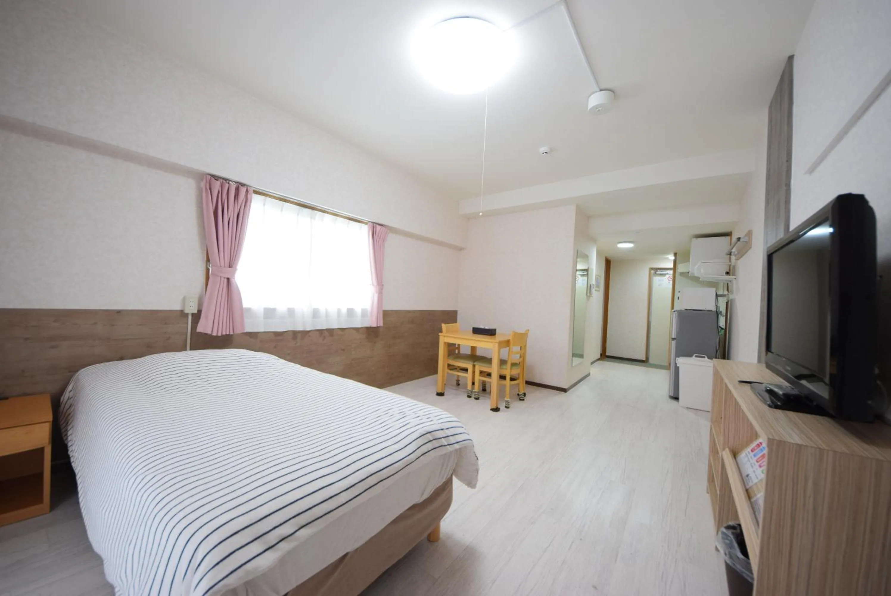 Bed, TV/Entertainment Center in STAY IN SUMUKA Kokusai Street