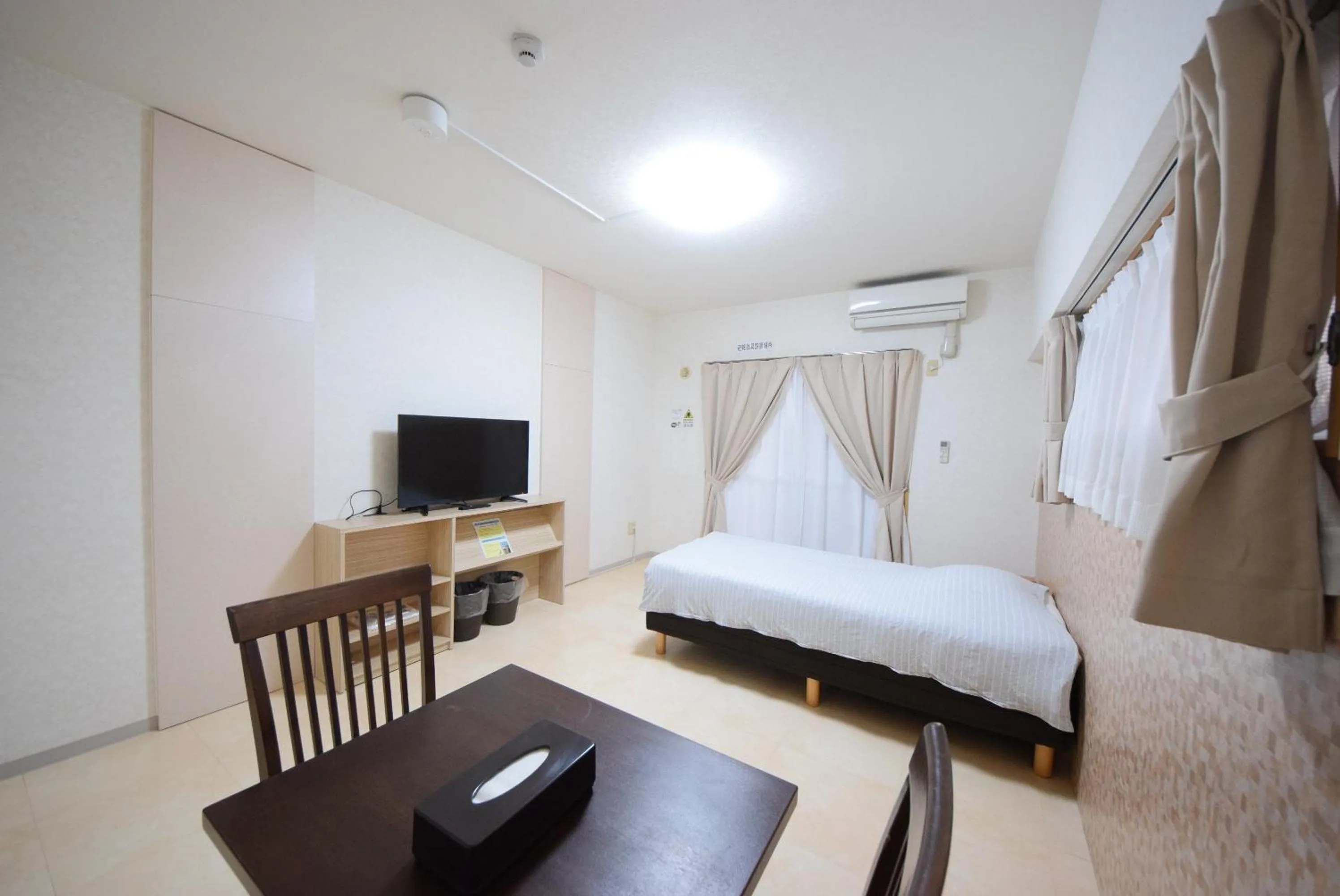 Photo of the whole room, TV/Entertainment Center in STAY IN SUMUKA Kokusai Street