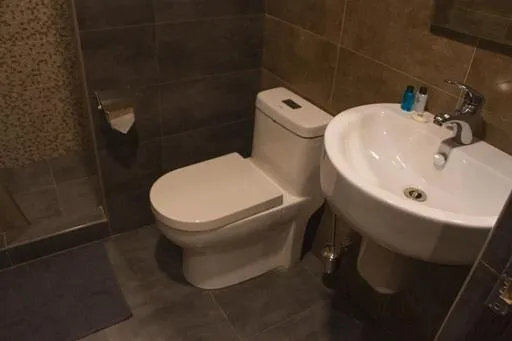 Toilet in Garden Lounge Hotel