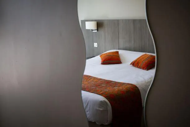 Bed in Hôtel Le Nautic