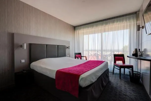 Photo of the whole room, Bed in Hôtel Le Nautic