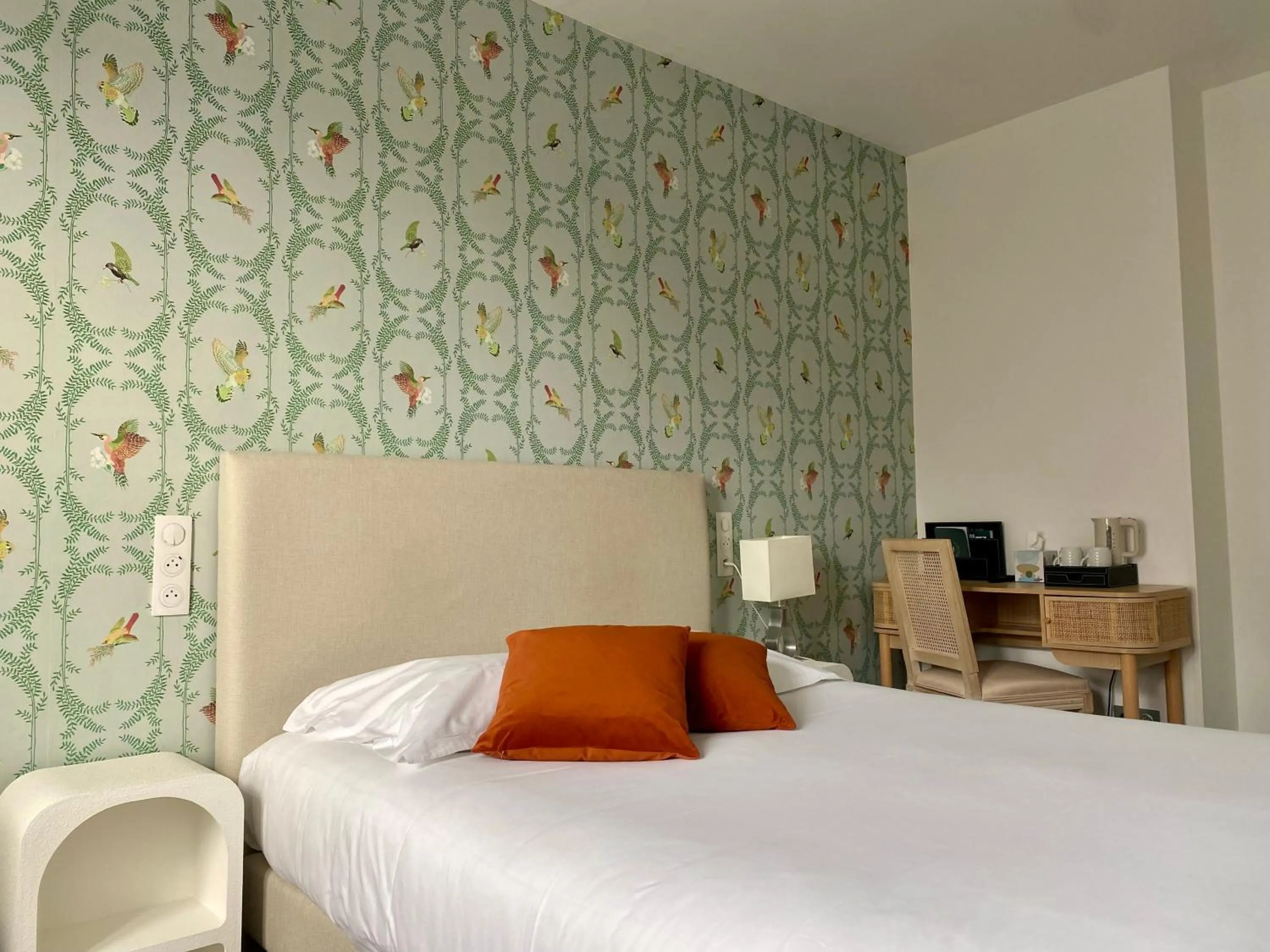 Bed in Logis Hôtel Marguerite