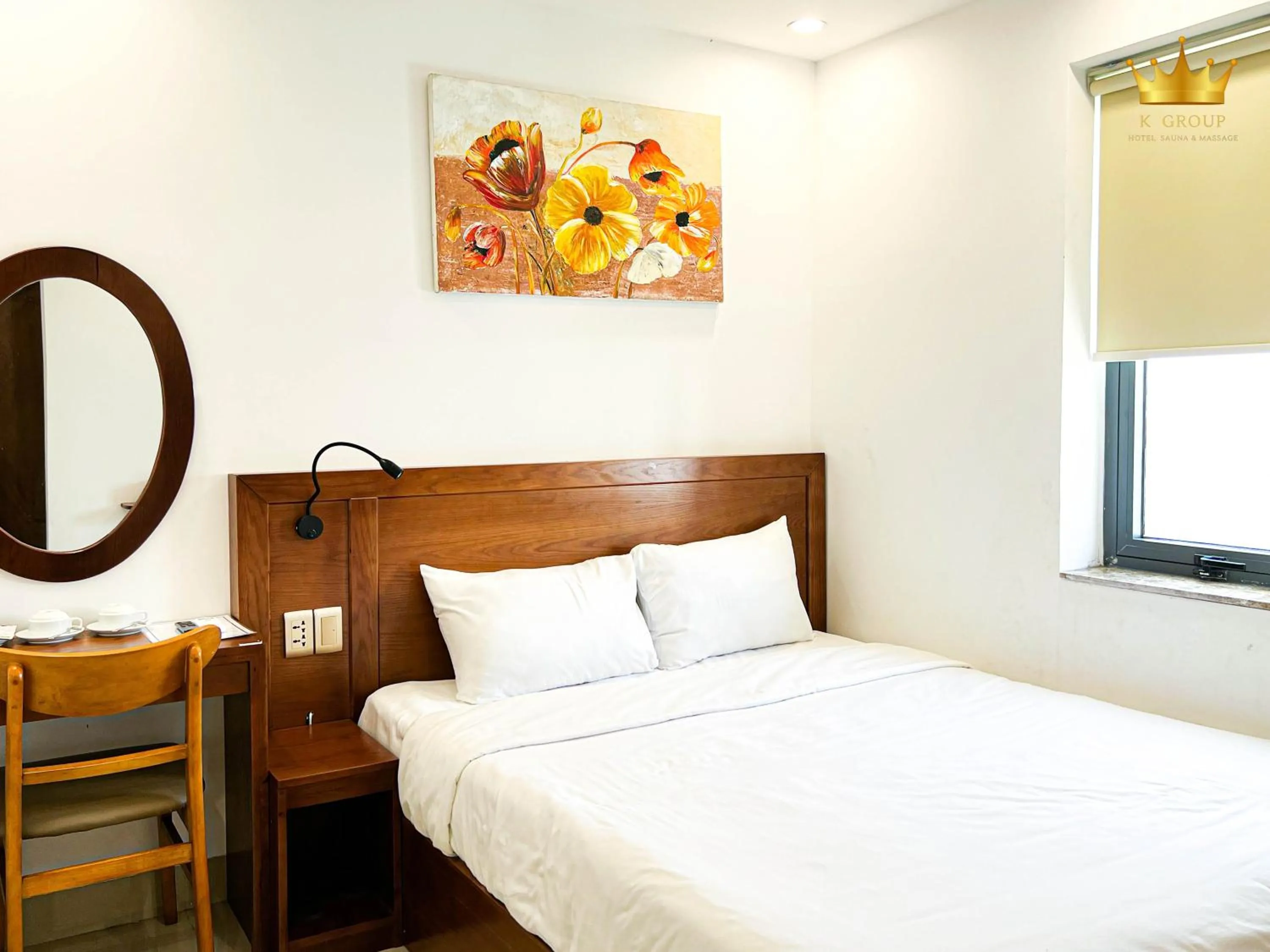 Bed in K Hotel Sauna and Massage