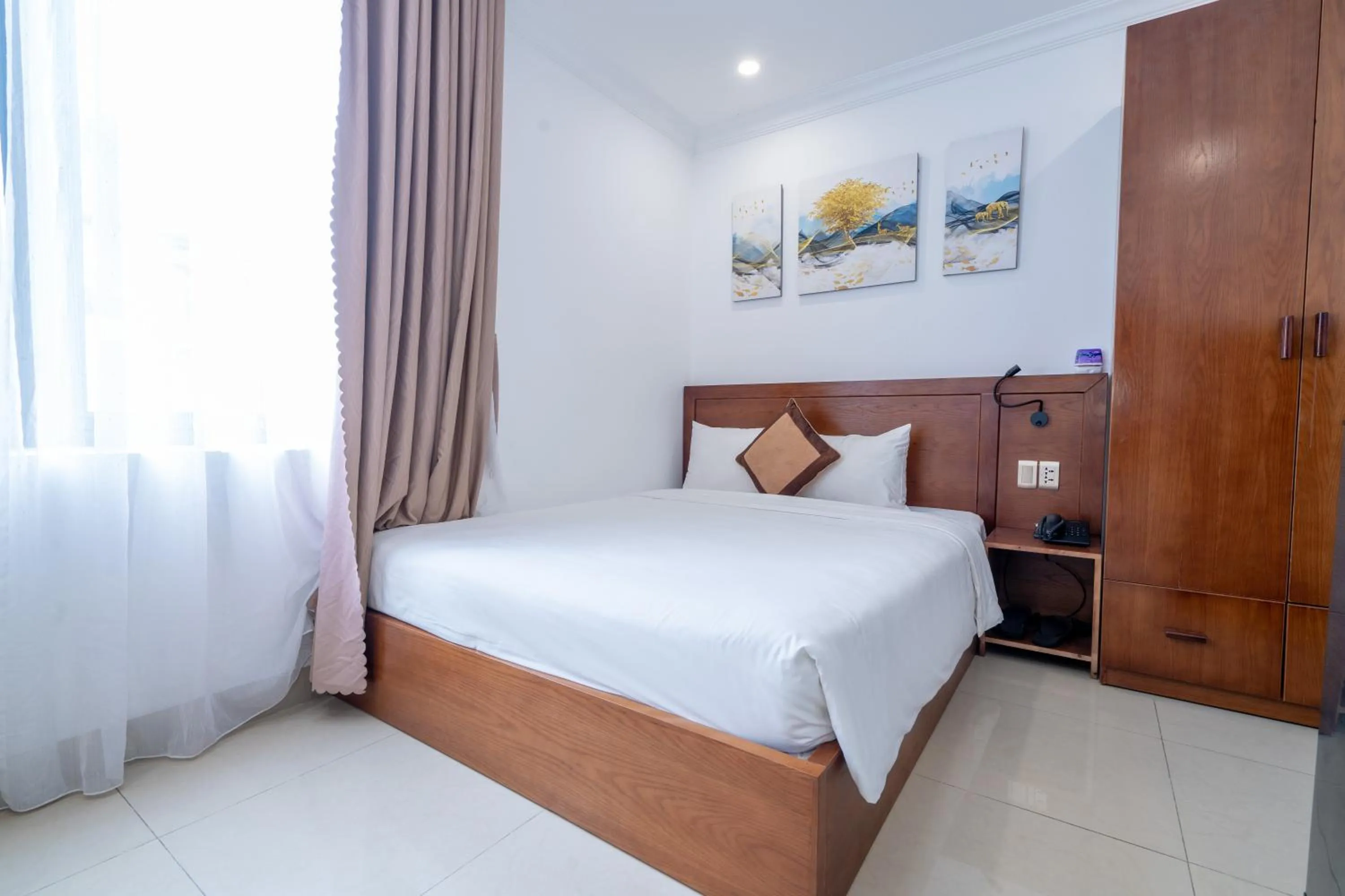 Bed in K Hotel Sauna and Massage