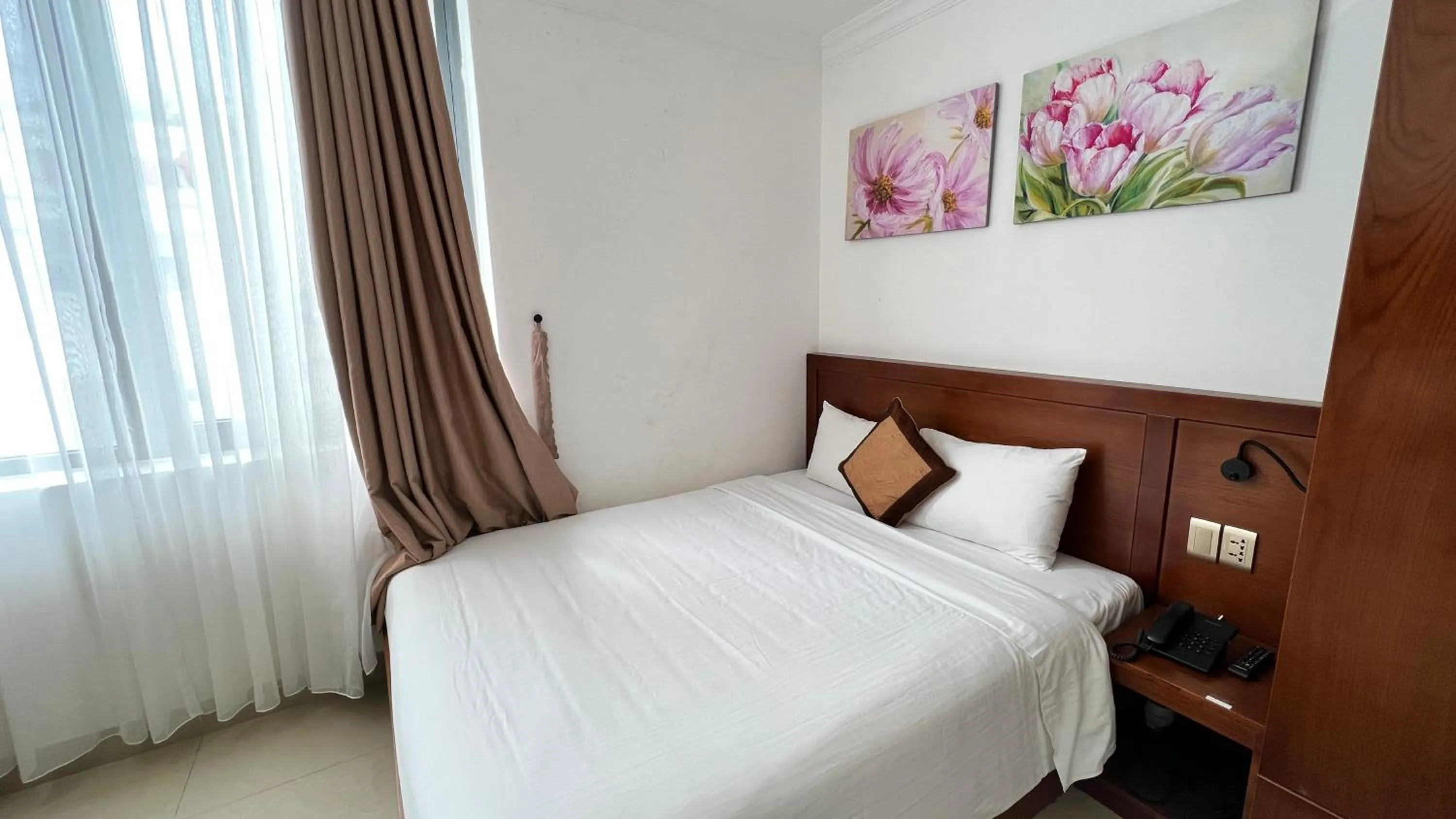 Bed in K Hotel Sauna and Massage