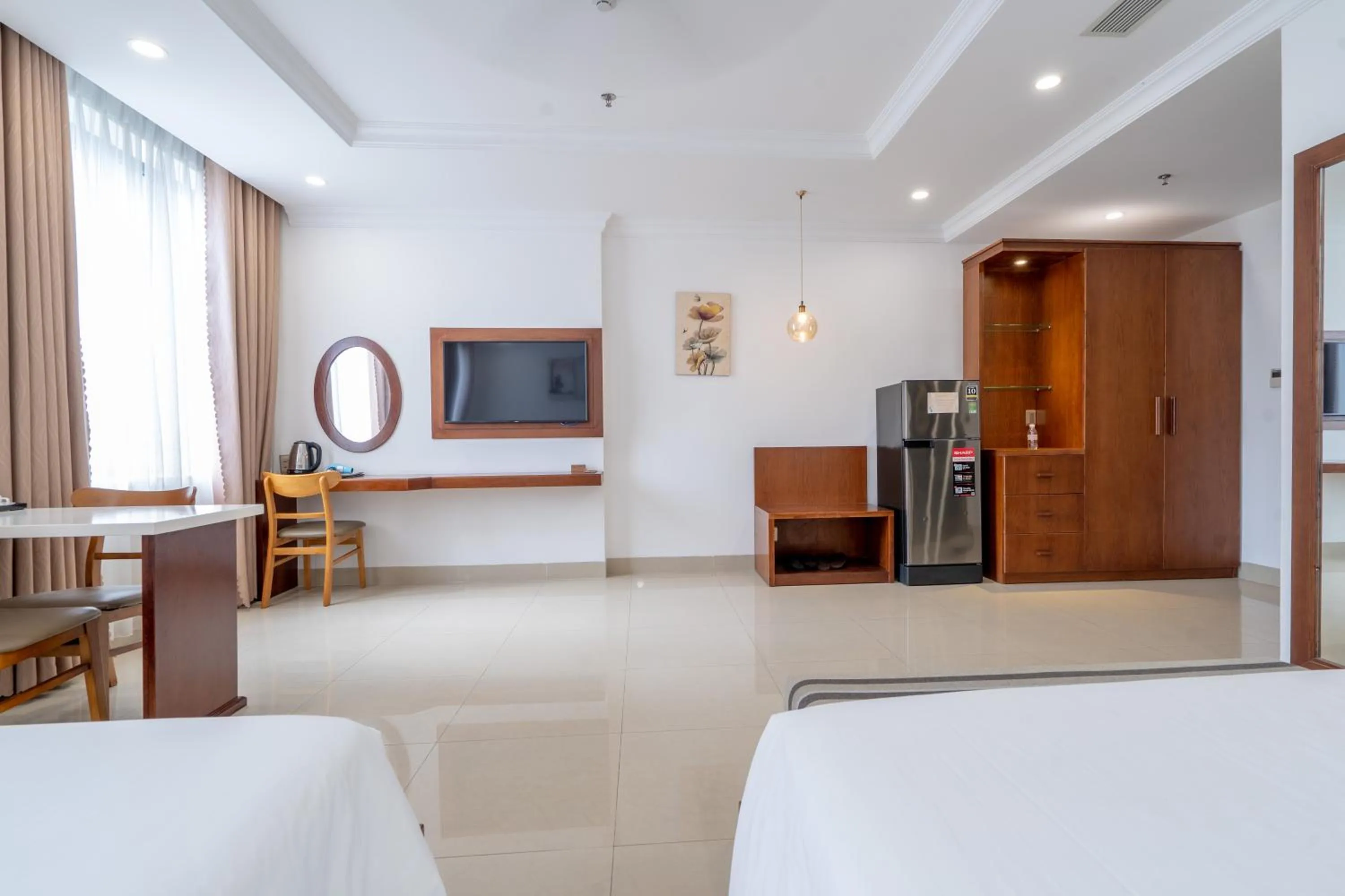 Bed in K Hotel Sauna and Massage