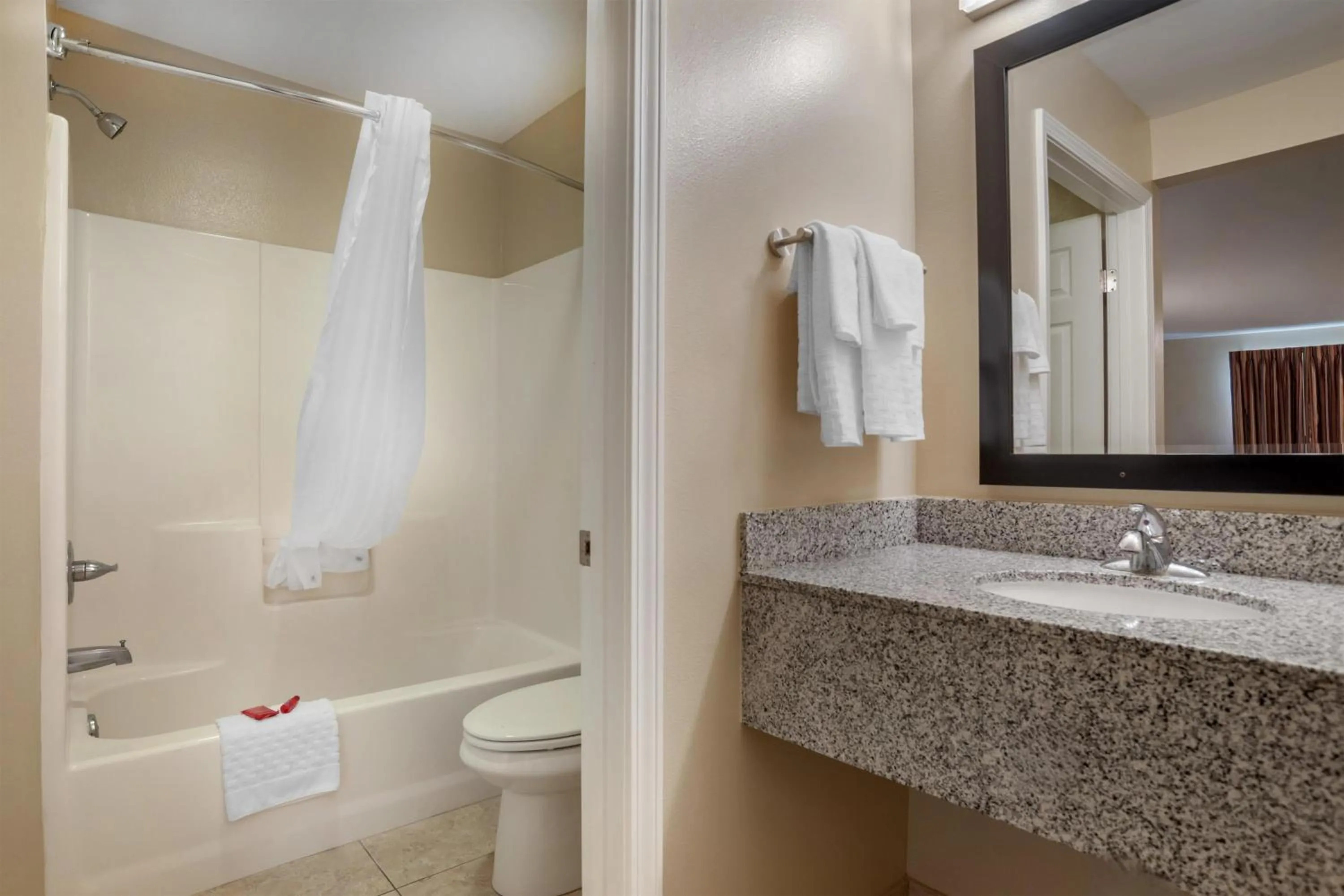 Bathroom in SureStay Studio by Best Western Gonzales