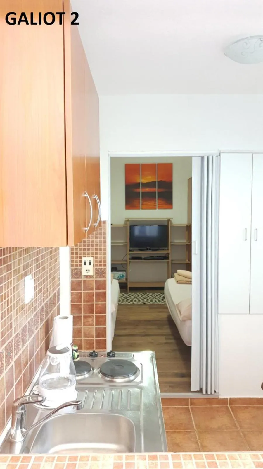 Kitchen or kitchenette, Bed in Apartmani Galiot