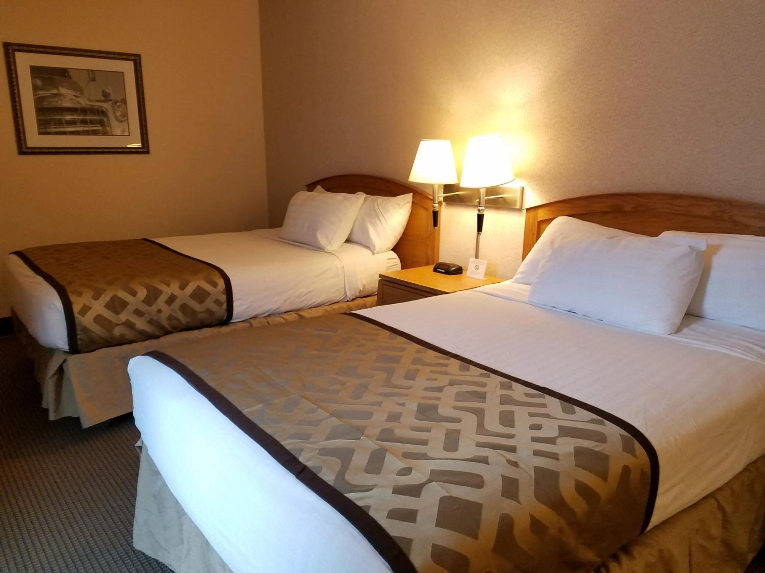 Bed in RiverTree Inn & Suites