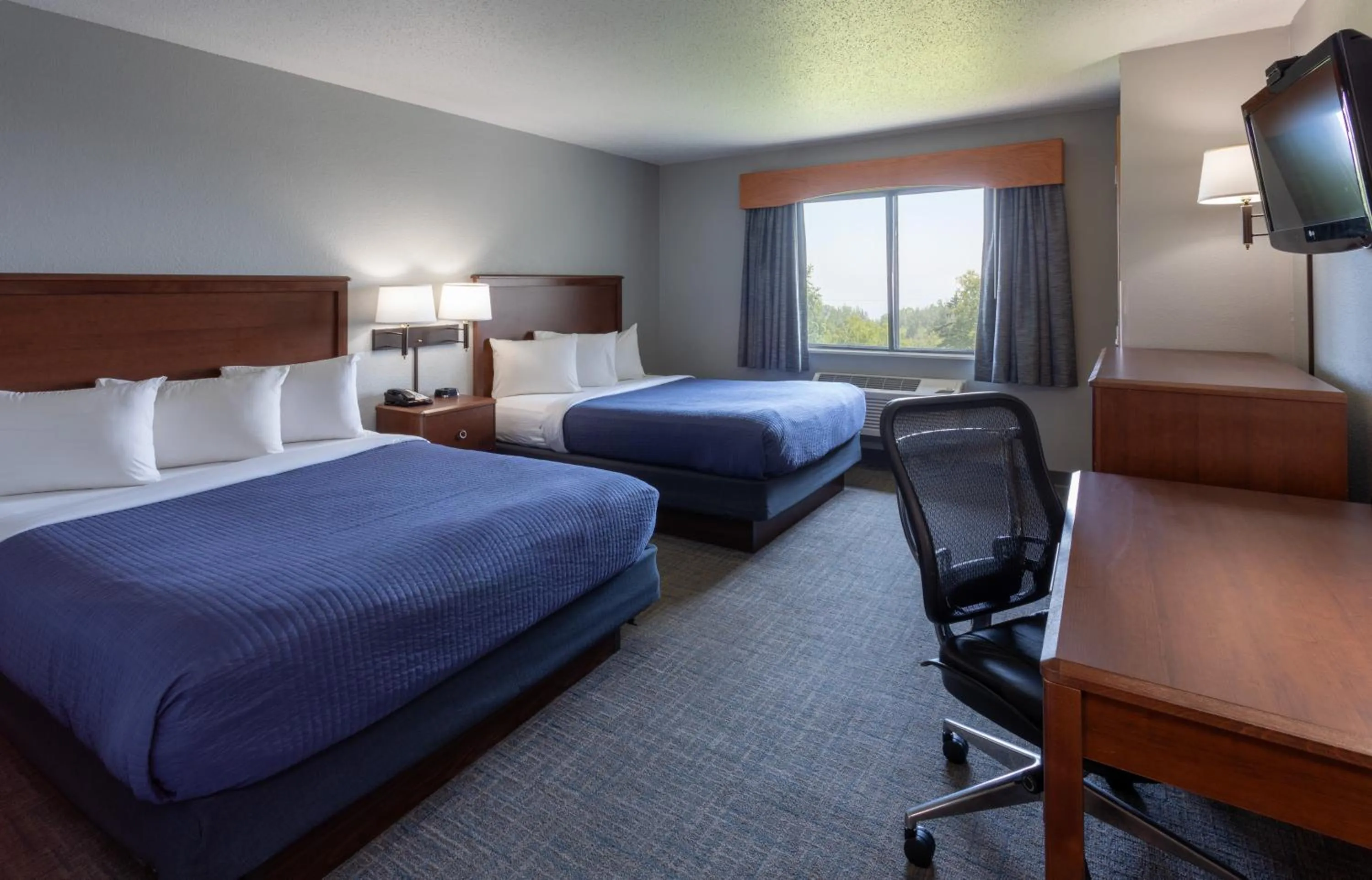 Bed in Black Beach Inn by GrandStay