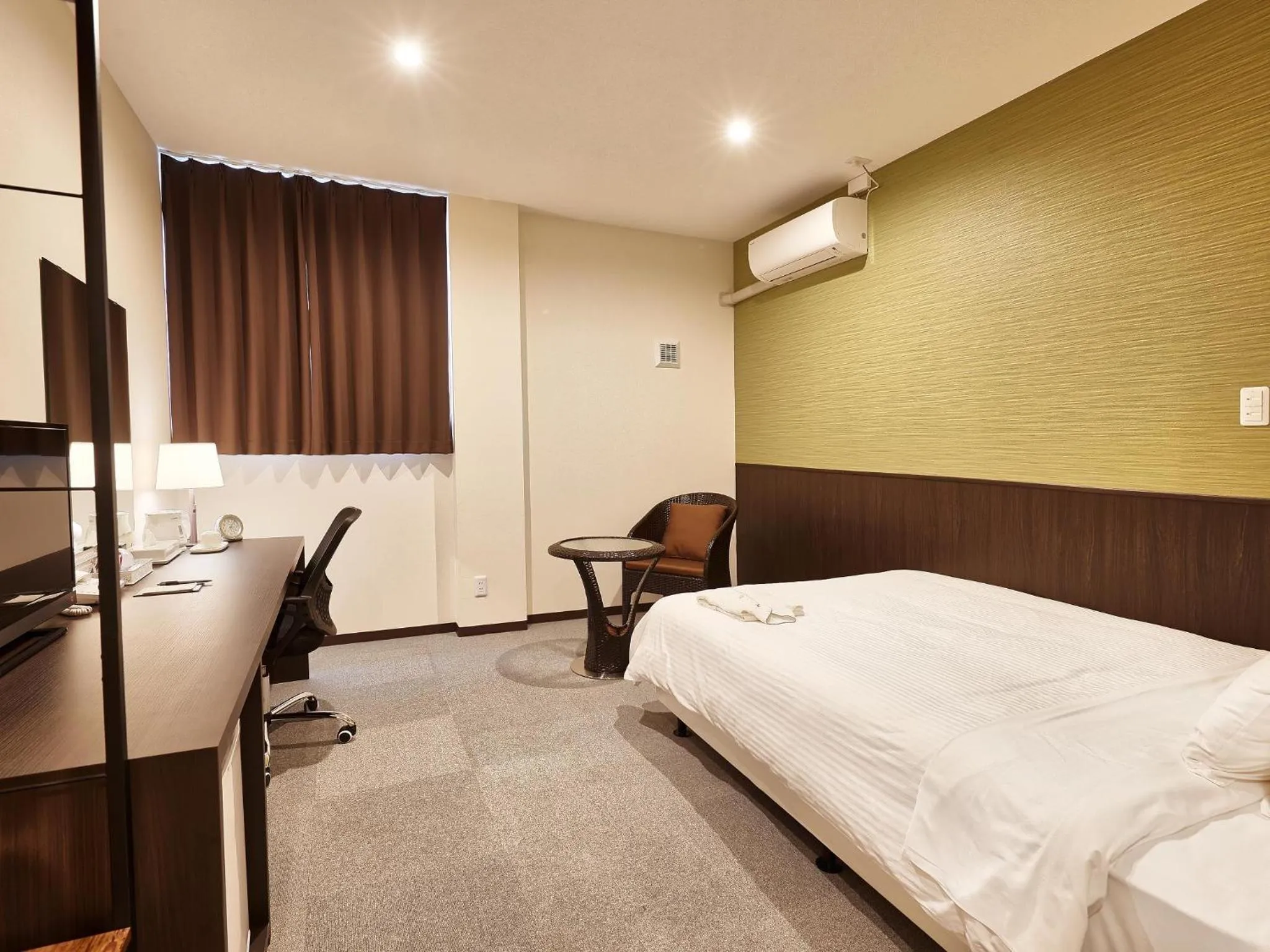 Living room, Bed in Crown Hotel Okinawa Annex