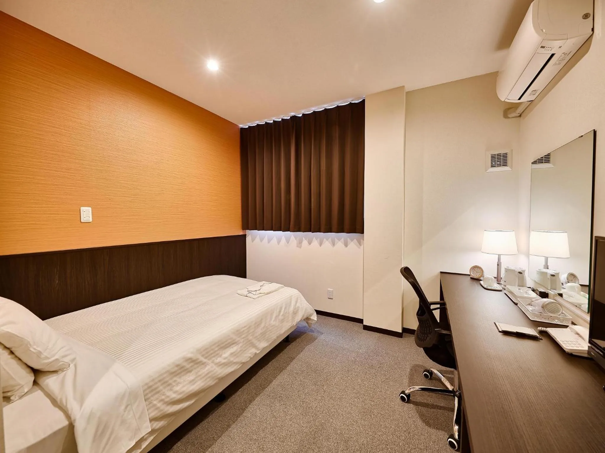 Living room, Bed in Crown Hotel Okinawa Annex