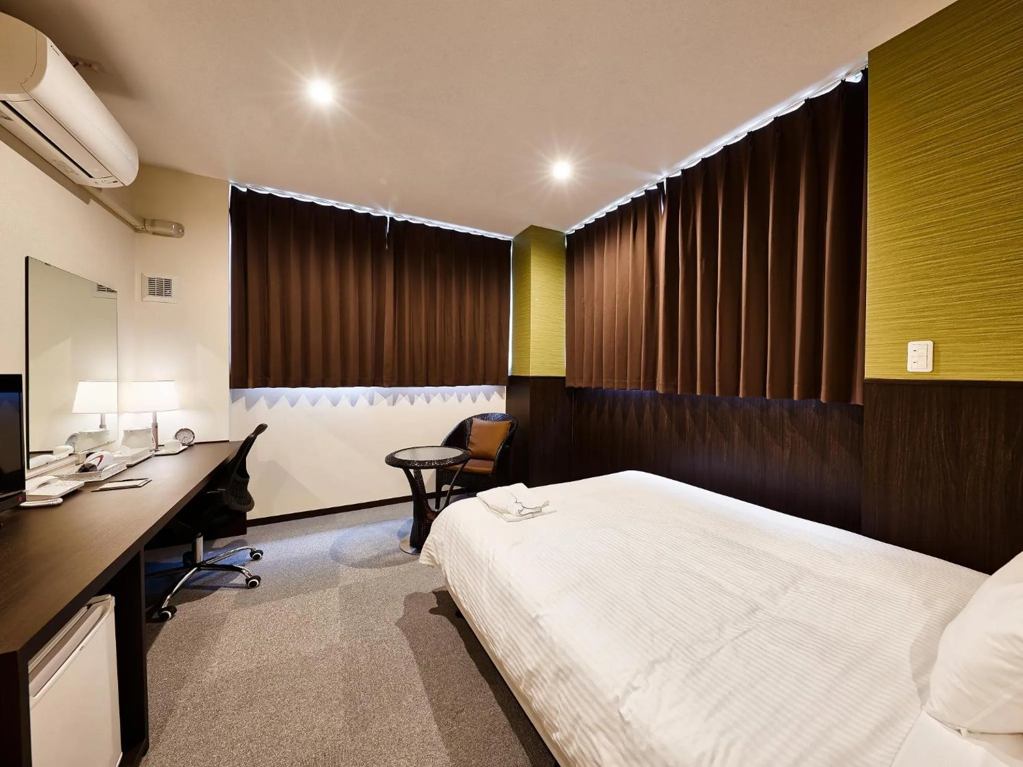 Living room, Bed in Crown Hotel Okinawa Annex