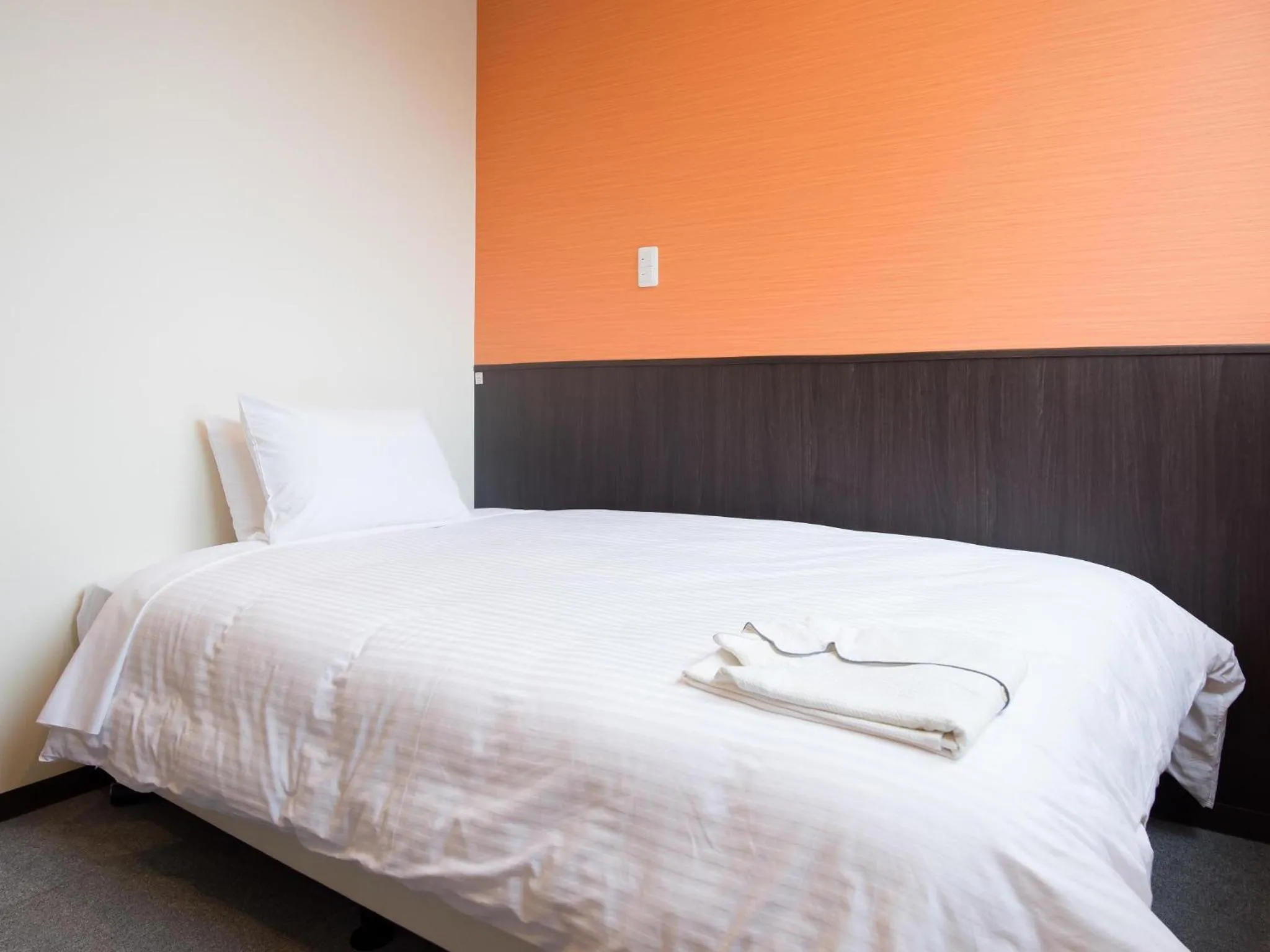 Bedroom, Bed in Crown Hotel Okinawa Annex