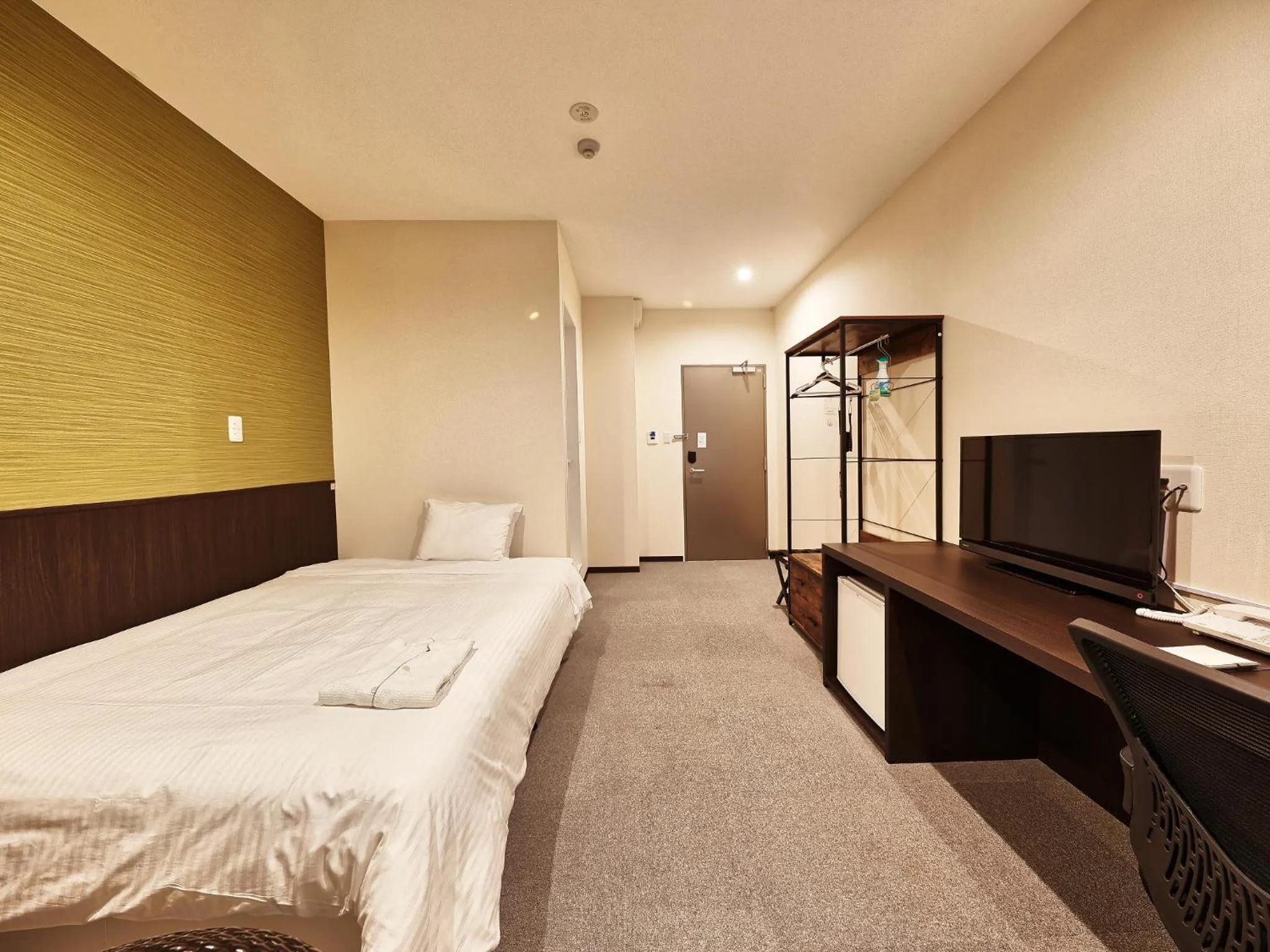 Living room, Bed in Crown Hotel Okinawa Annex