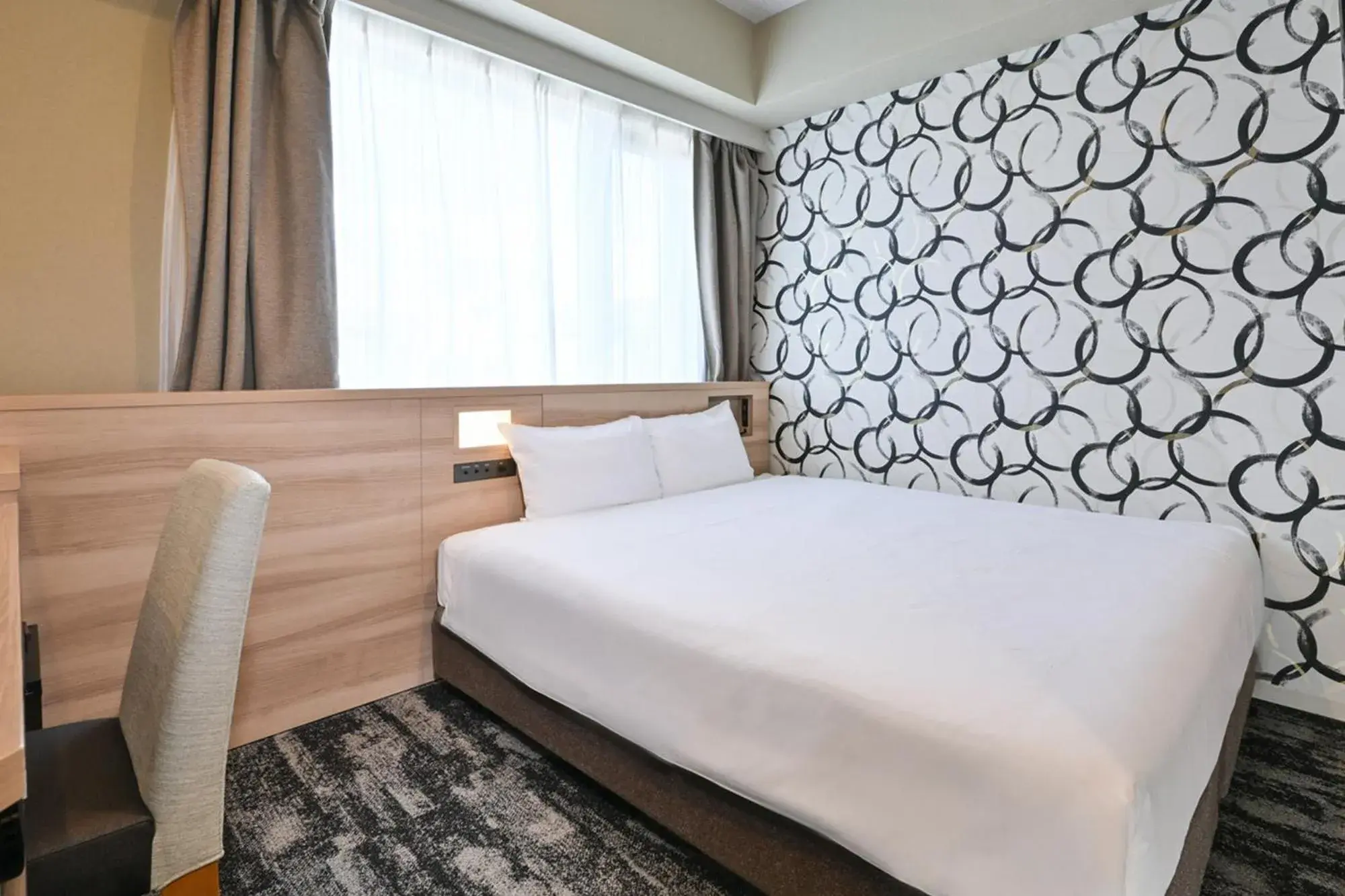 Bed in Sanco Inn Kyoto Hachijoguchi Shikinoyu Bed in Sanco Inn Kyoto Hachijoguchi Shikinoyu