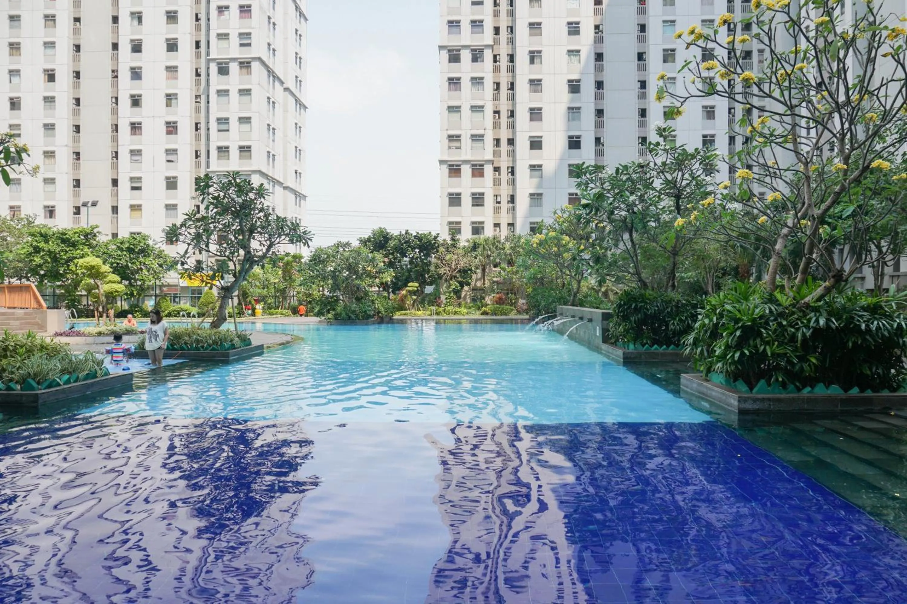Property building in Spacious 2BR Green Bay Pluit Apartment By Travelio