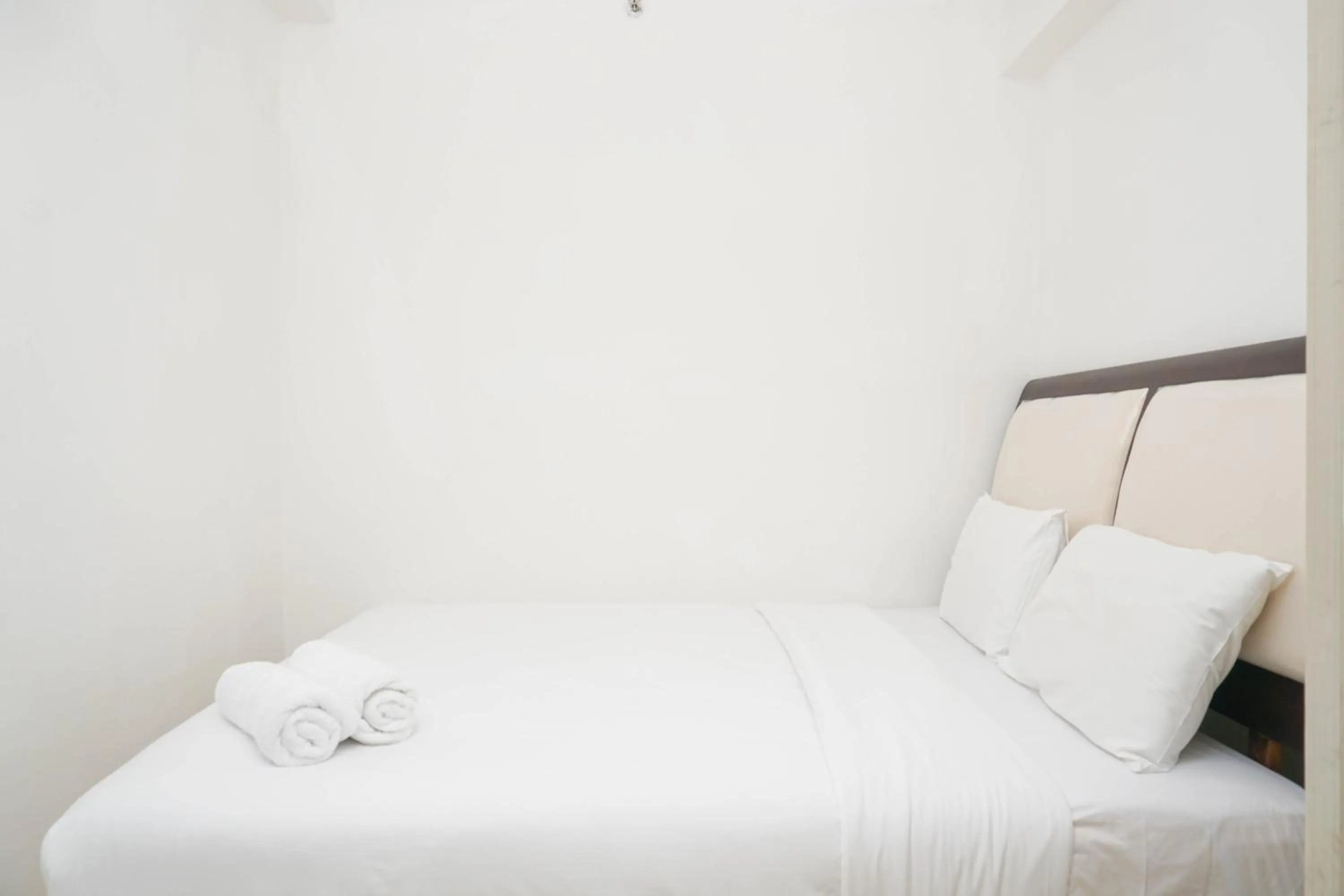 Bed in Spacious 2BR Green Bay Pluit Apartment By Travelio