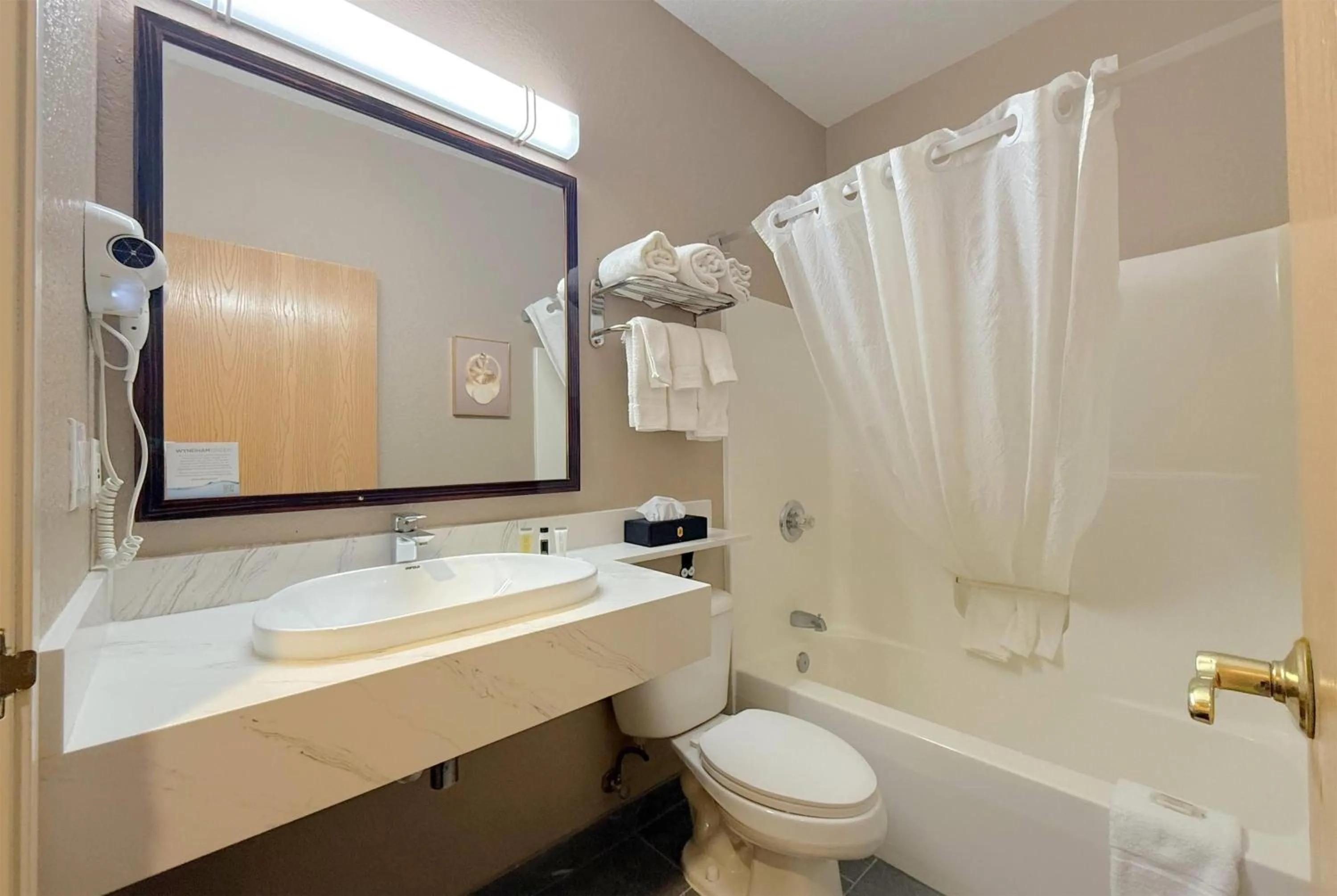 Bathroom in Super 8 by Wyndham Uniontown PA