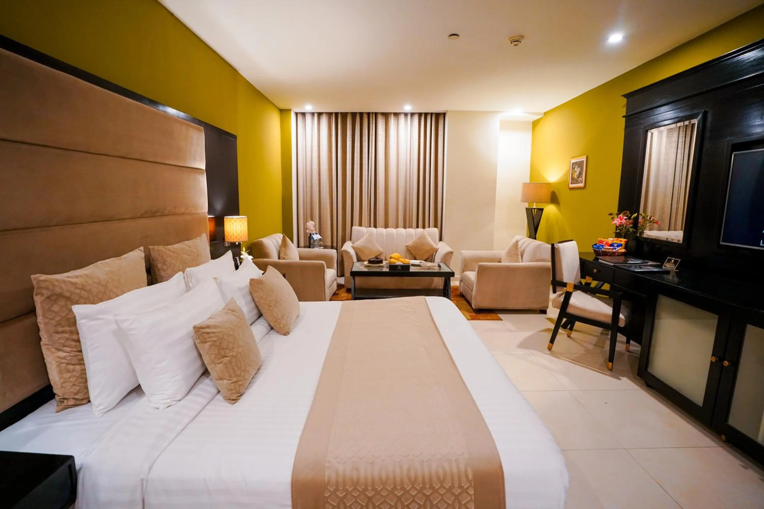 Photo of the whole room, Bed in Nine Tree Luxury Hotel & Suites Lahore