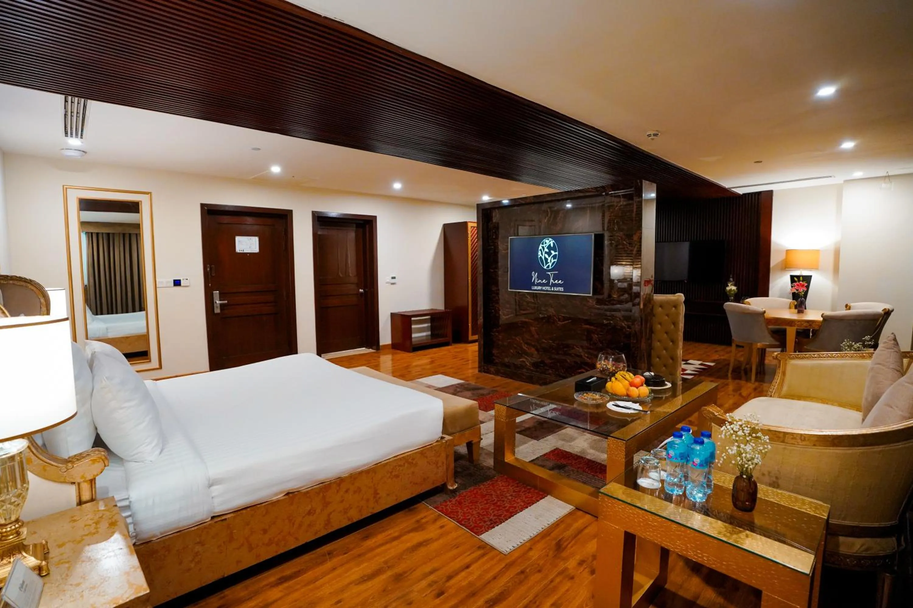 Photo of the whole room, Bed in Nine Tree Luxury Hotel & Suites Lahore