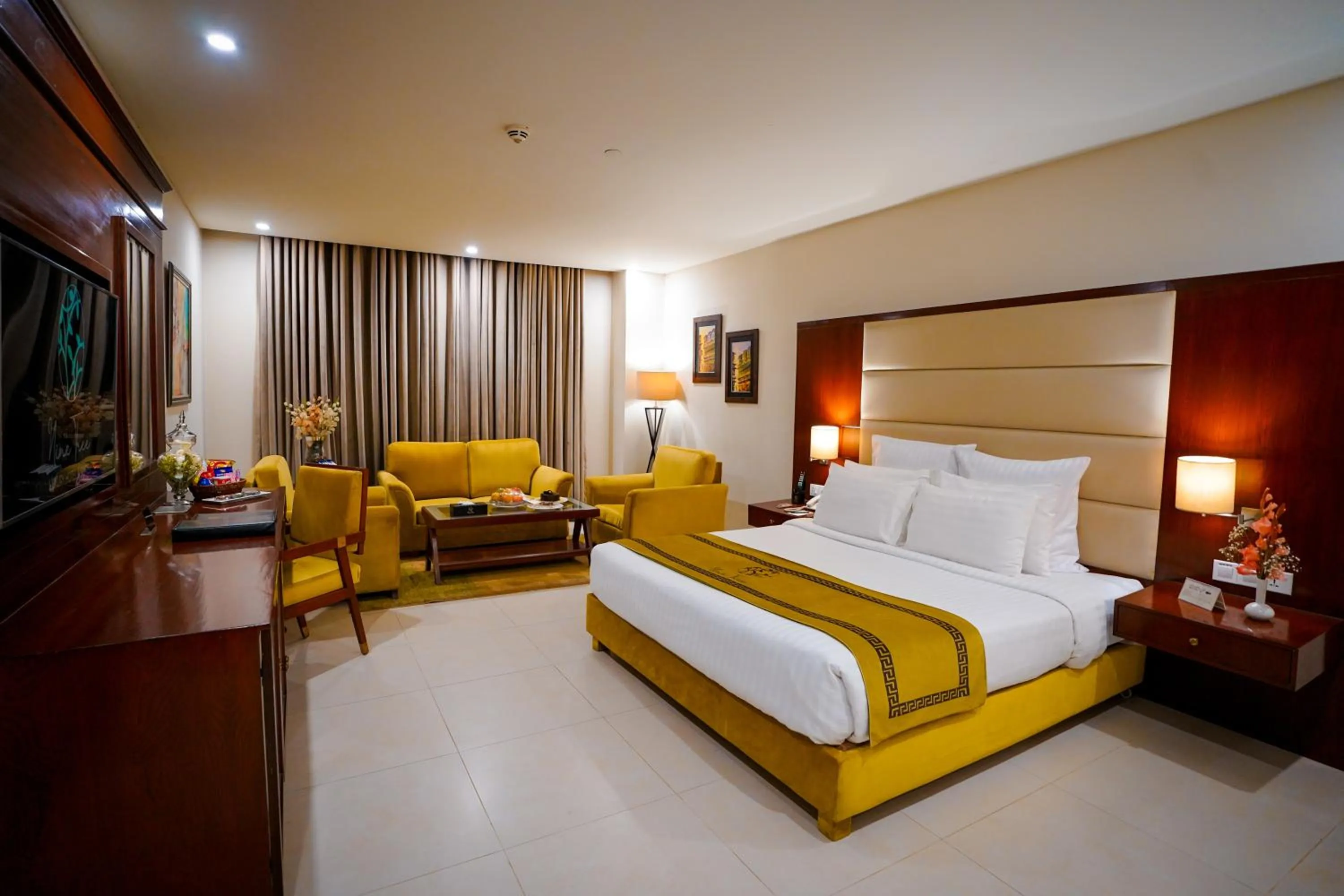Photo of the whole room, Bed in Nine Tree Luxury Hotel & Suites Lahore