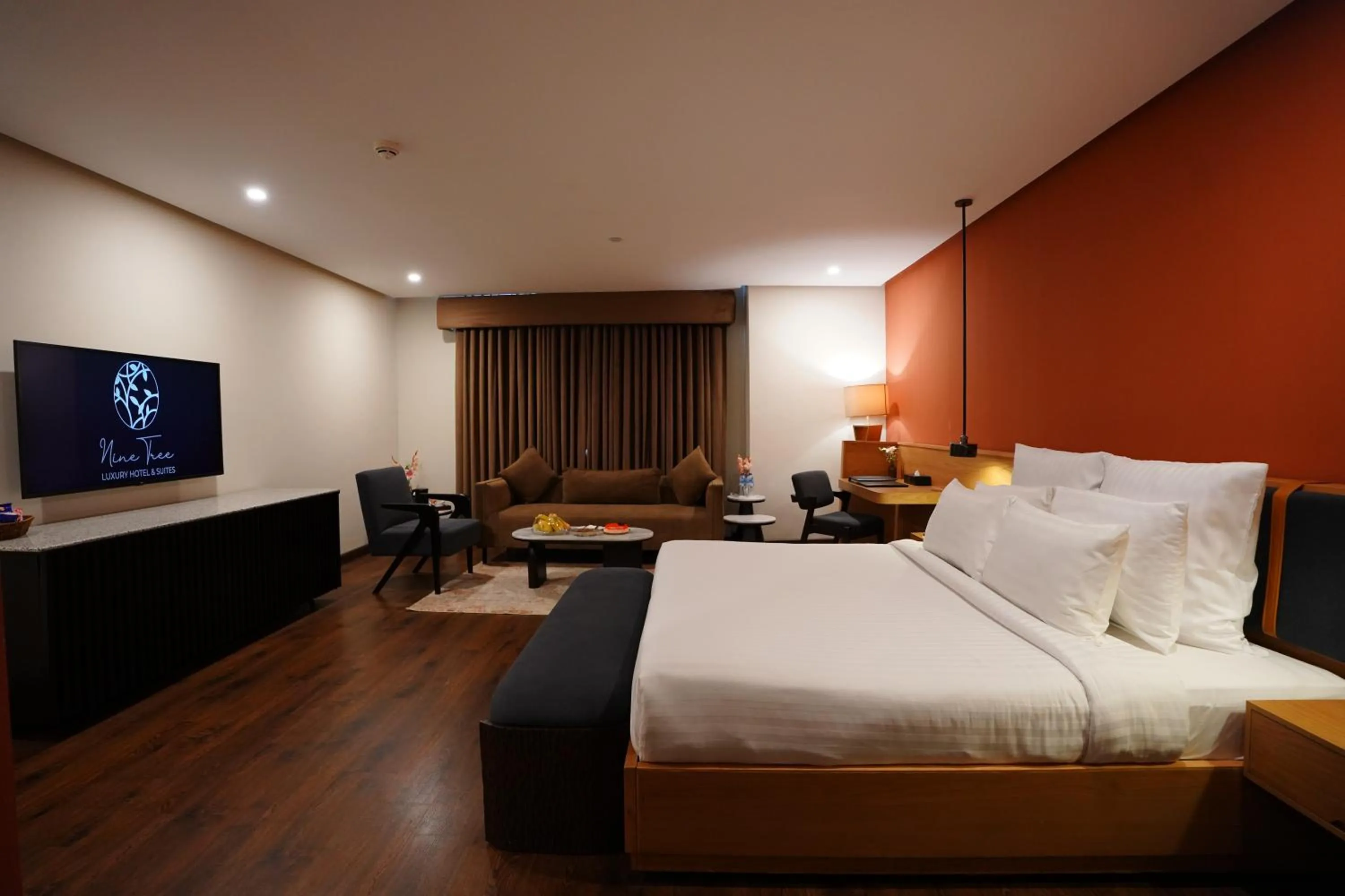 Photo of the whole room, Bed in Nine Tree Luxury Hotel & Suites Lahore