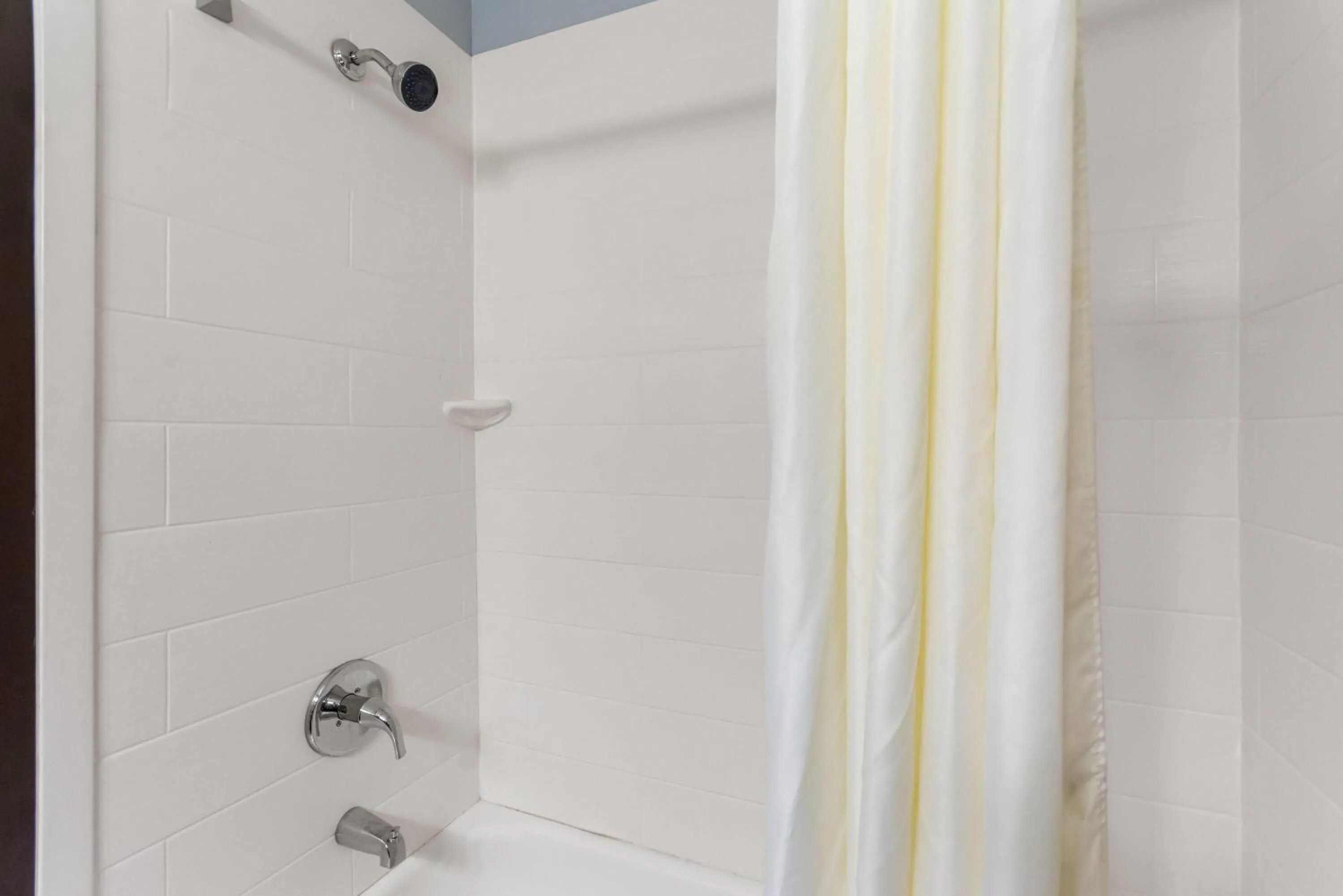 Bathroom in Super 8 by Wyndham Bloomington University Area