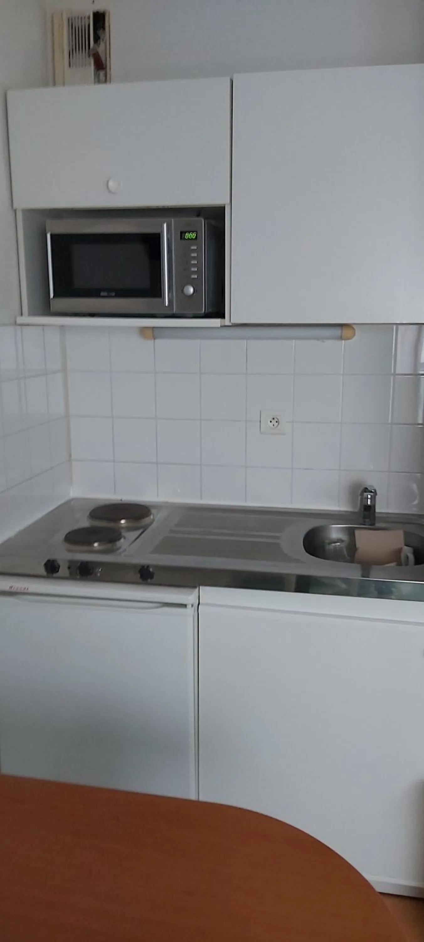 Kitchen or kitchenette in The Originals Residence Appart'Hôtel Lauréades Clermont-Ferrand Centre Jaude