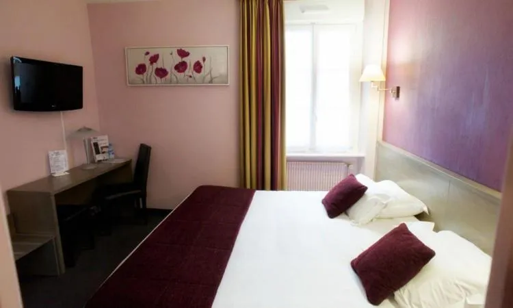 Bed in Brit Hotel Le Surcouf