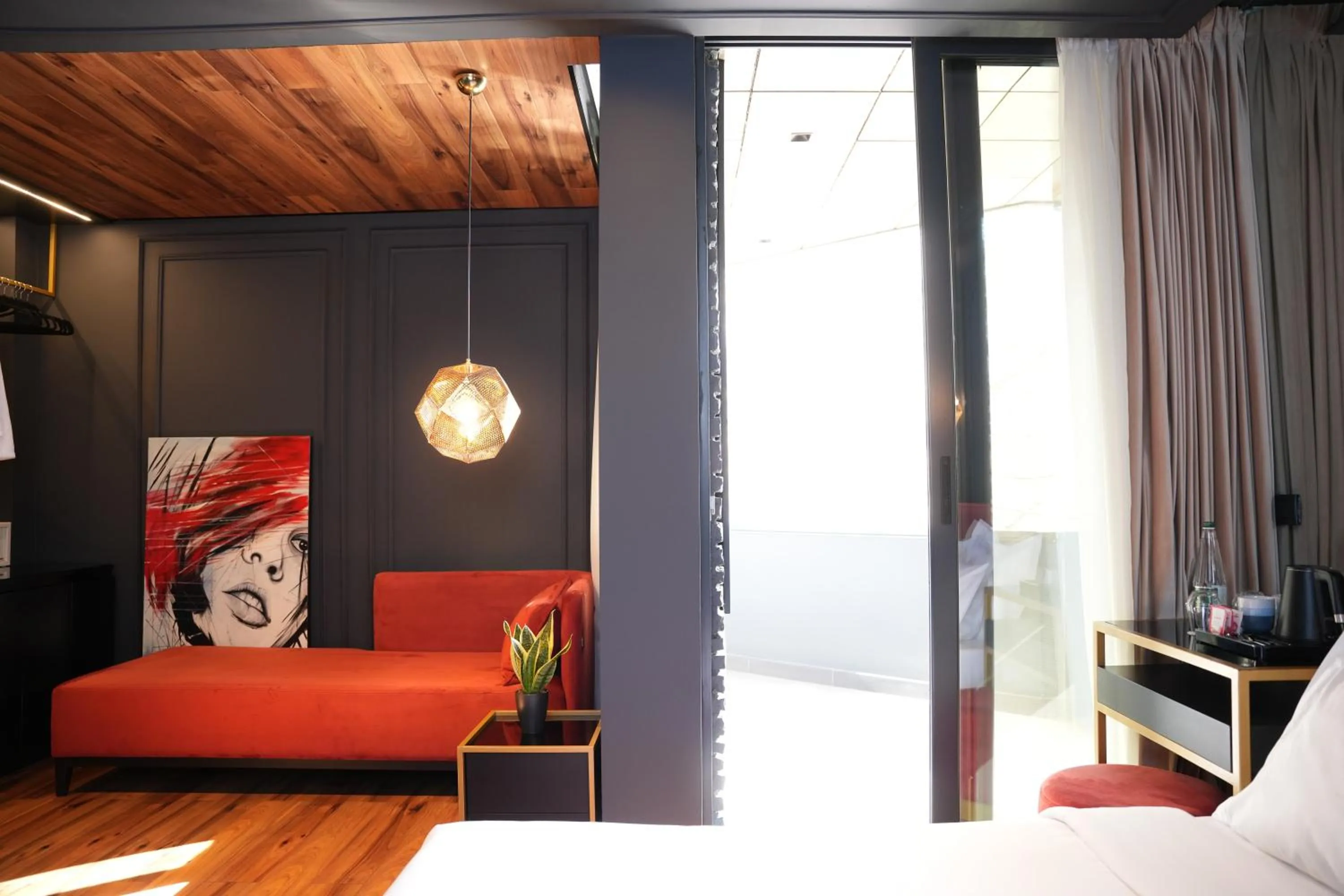 Bed in La Suite Boutique Hotel