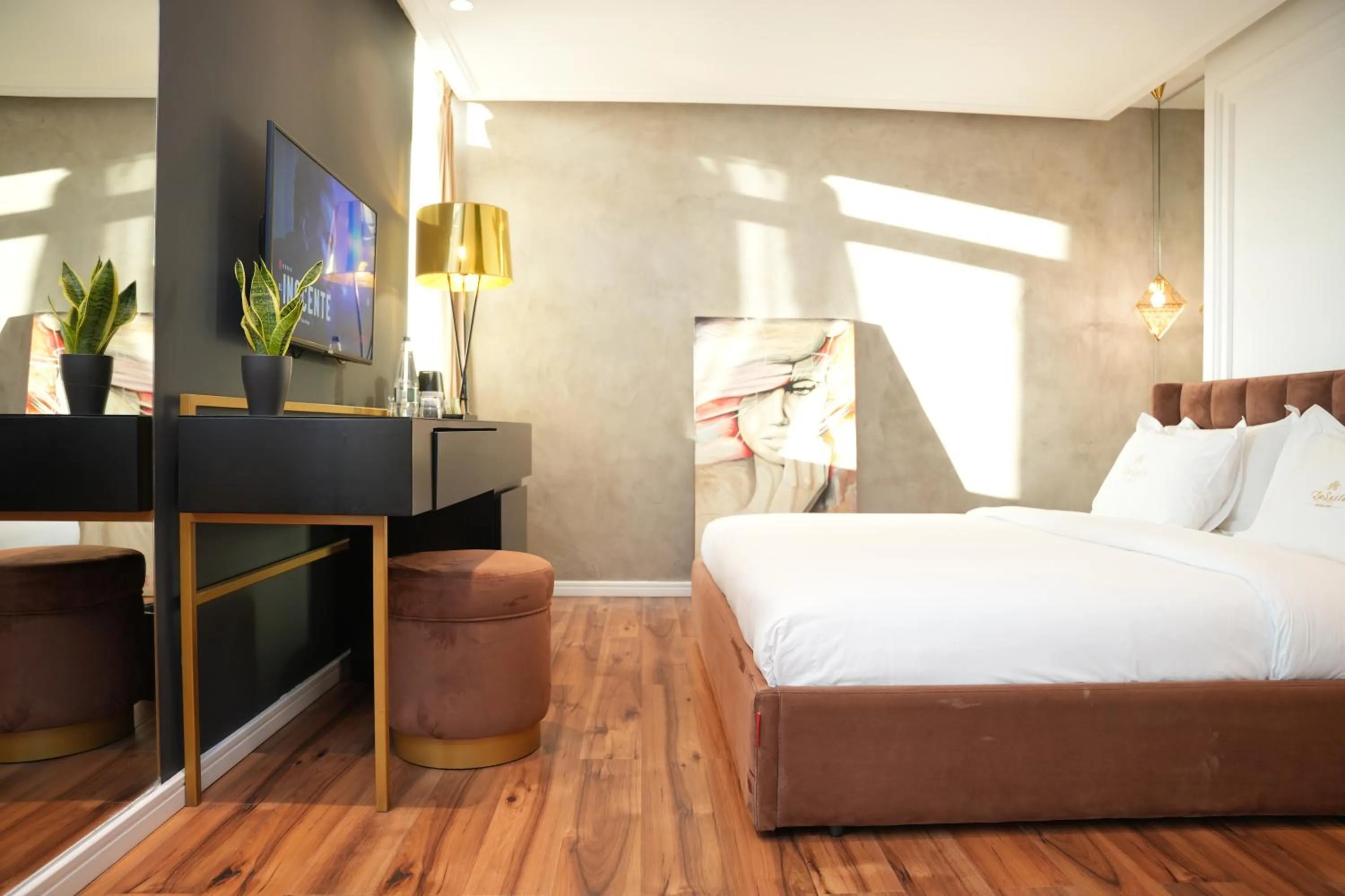 Bed in La Suite Boutique Hotel