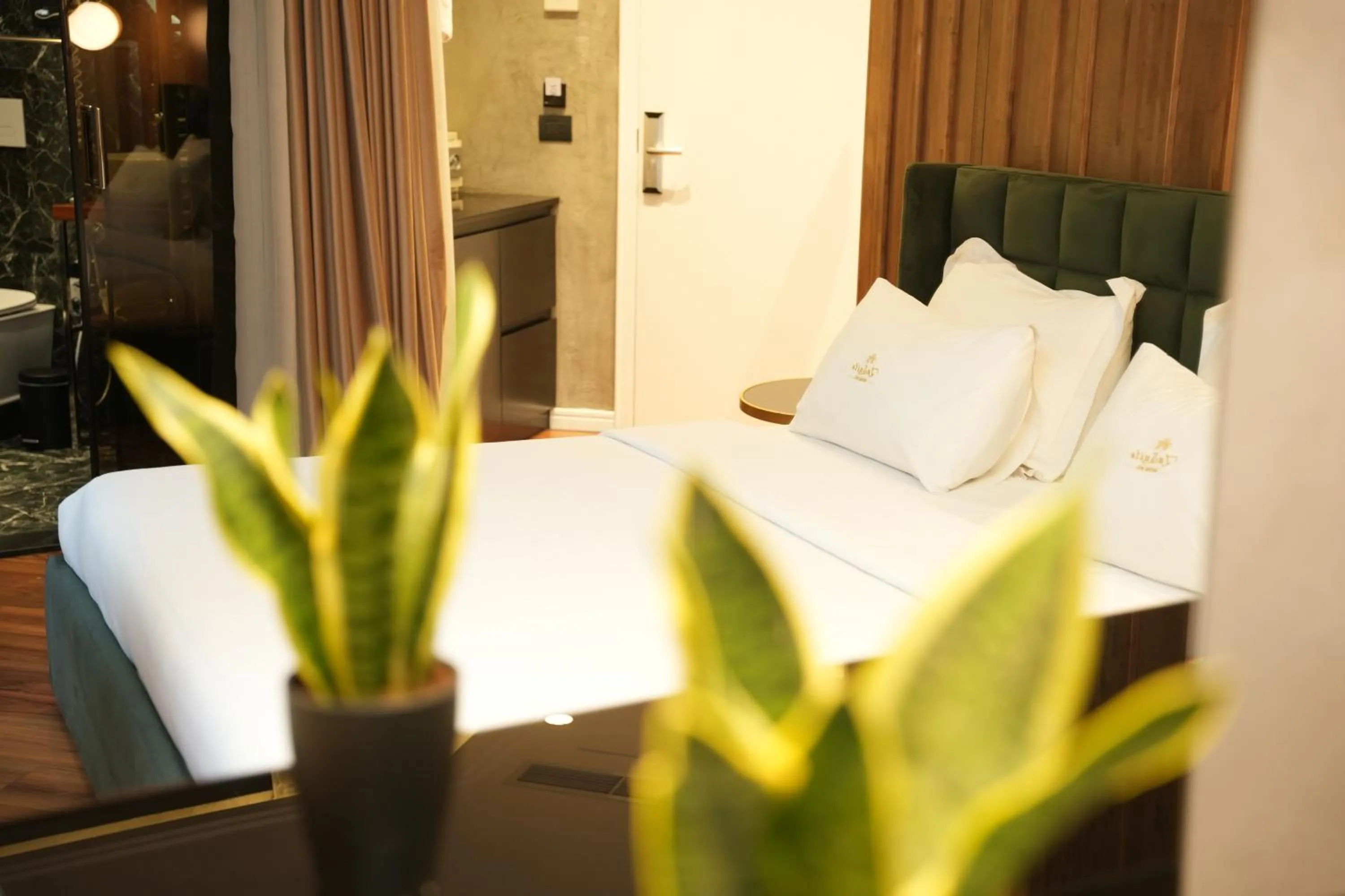 Bed in La Suite Boutique Hotel