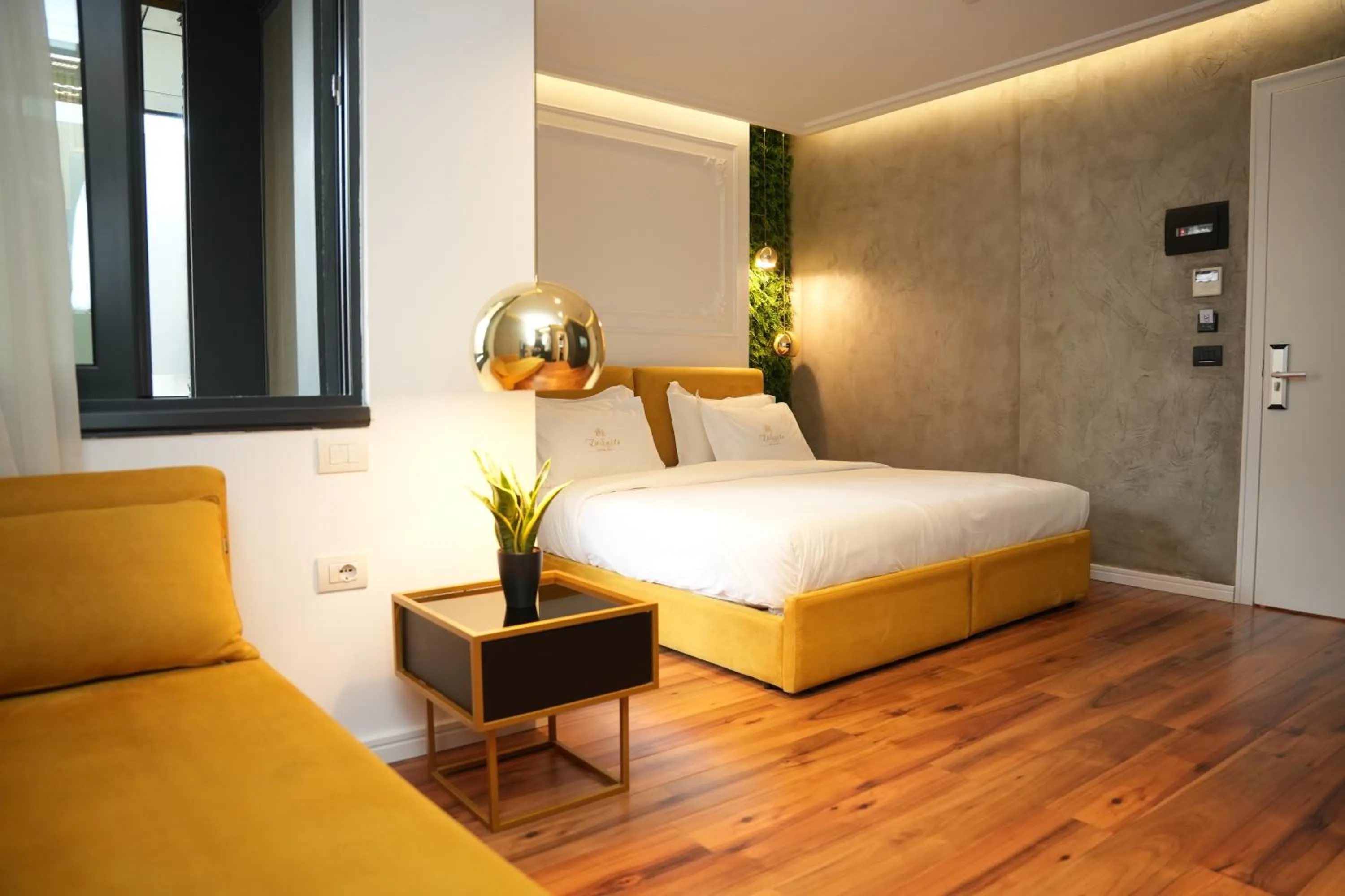 Bed in La Suite Boutique Hotel