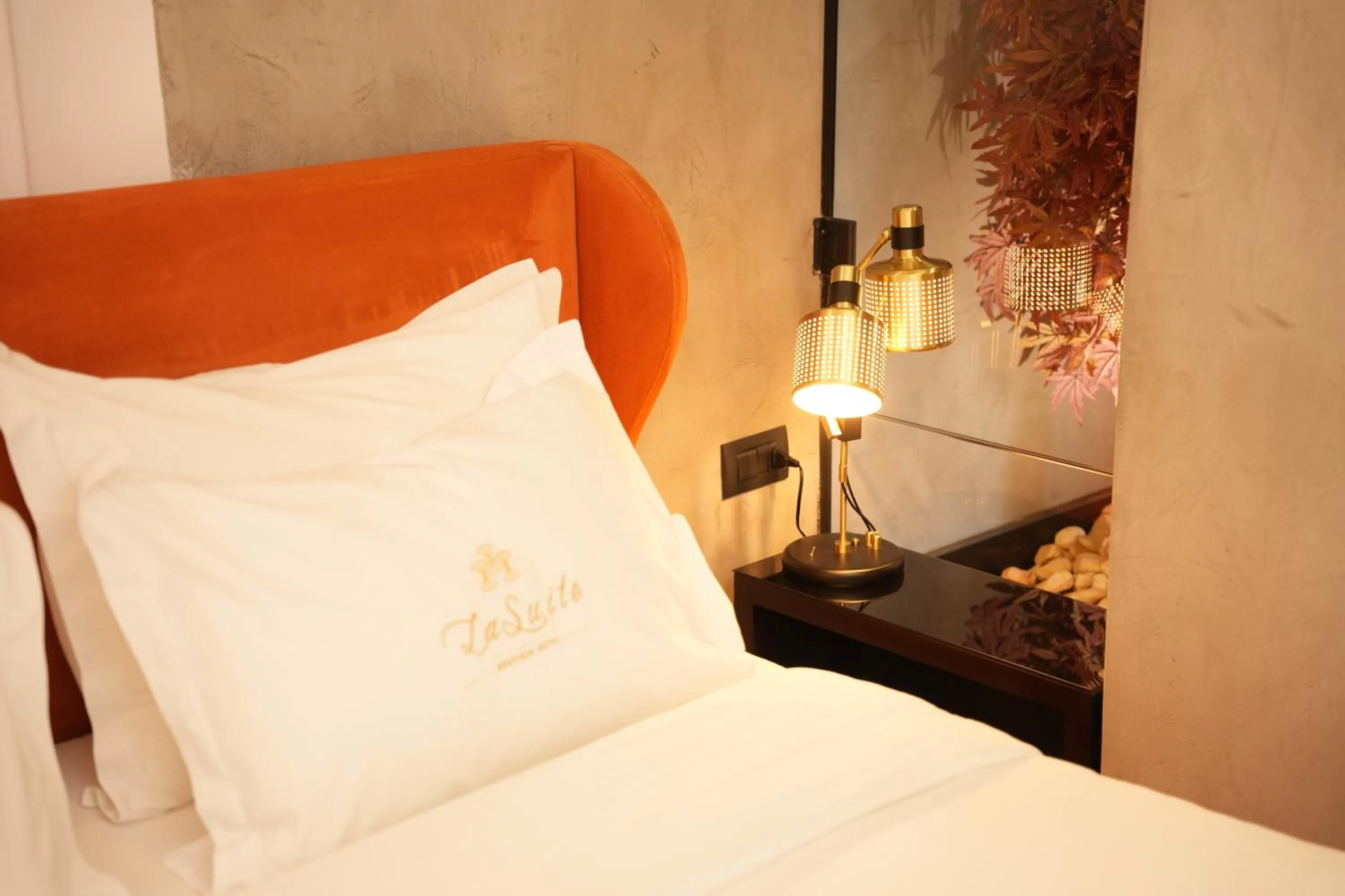 Bed in La Suite Boutique Hotel