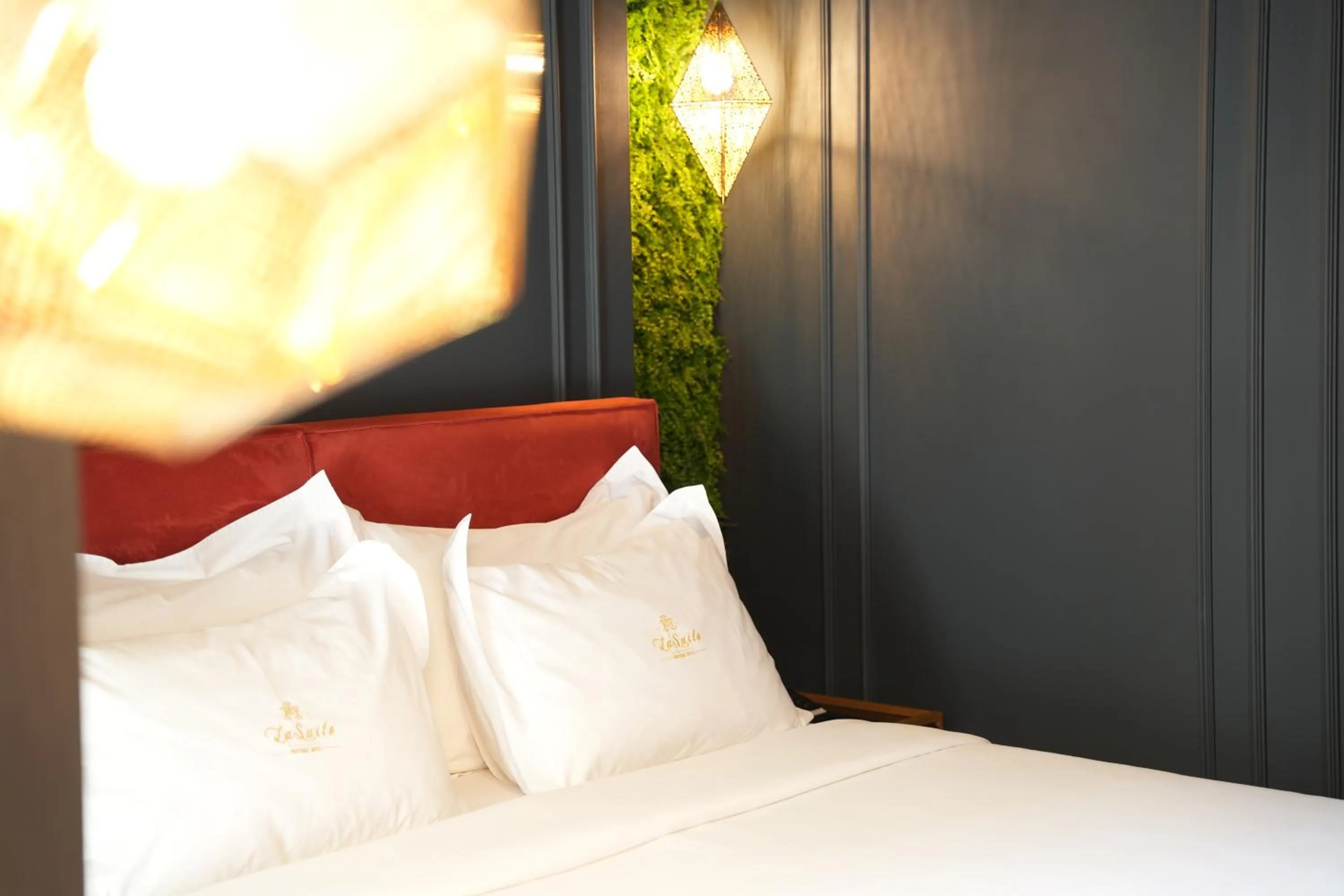 Bed in La Suite Boutique Hotel