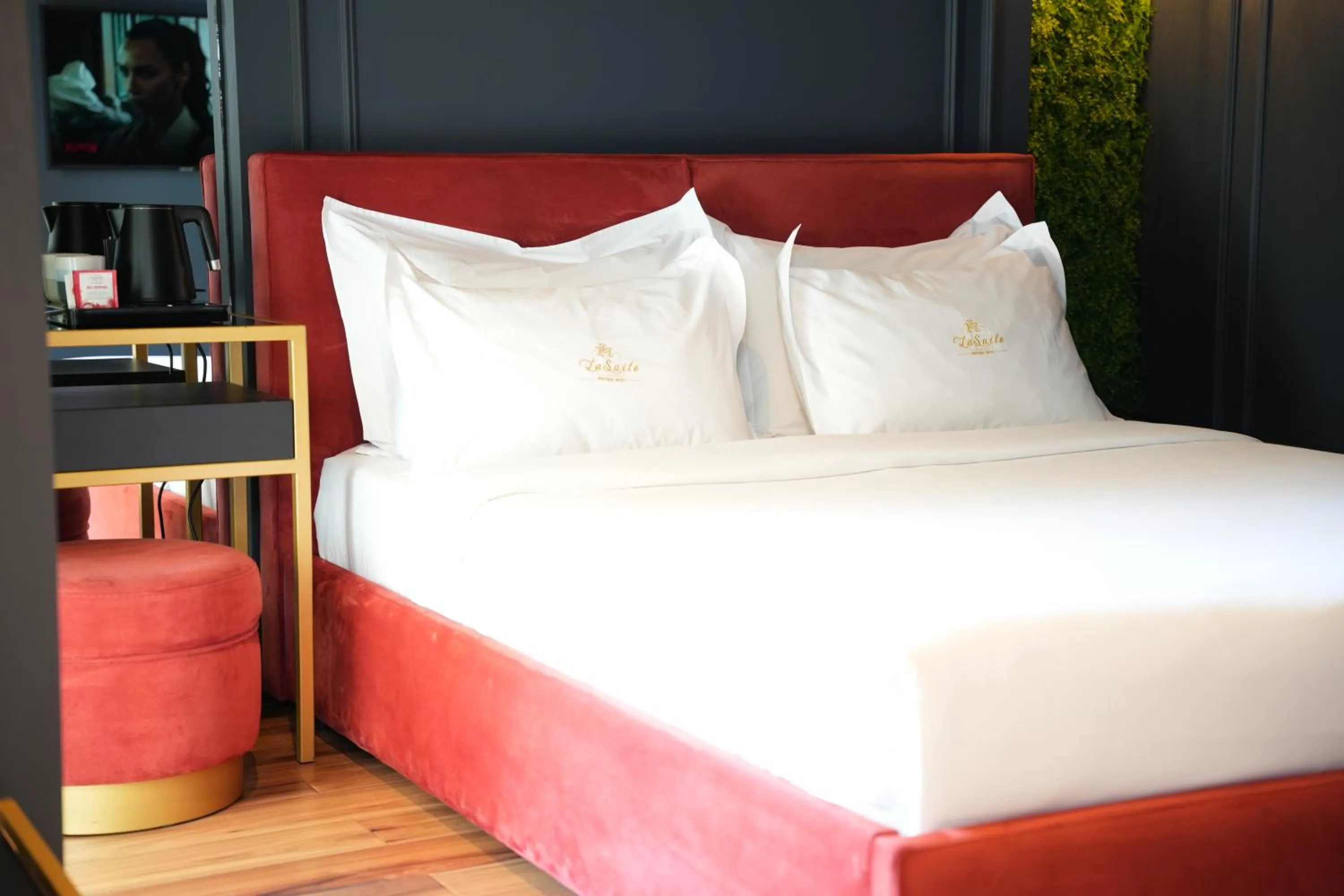 Bed in La Suite Boutique Hotel